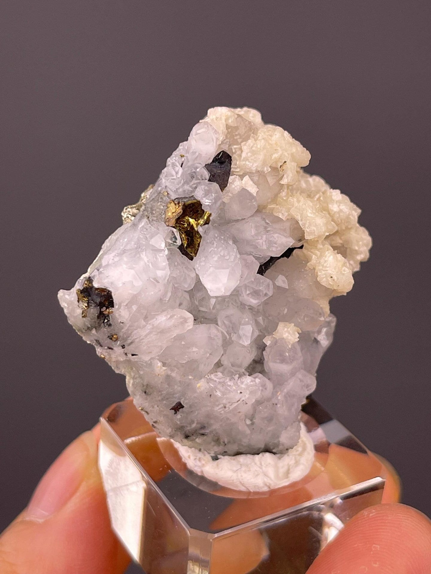 Angled view of quartz cluster with mineral accents