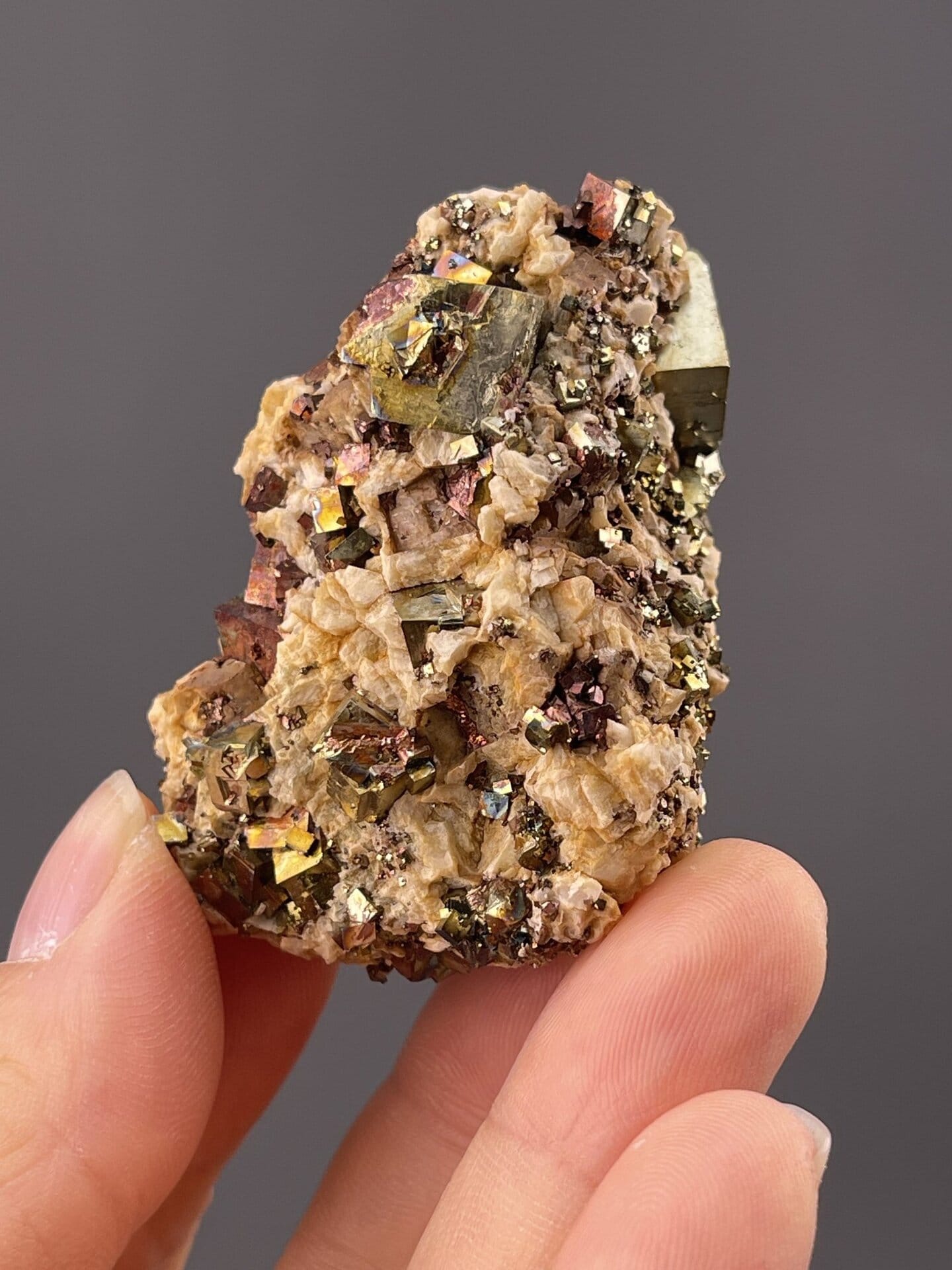 Detail of chalcopyrite surface showing metallic rainbow sheen