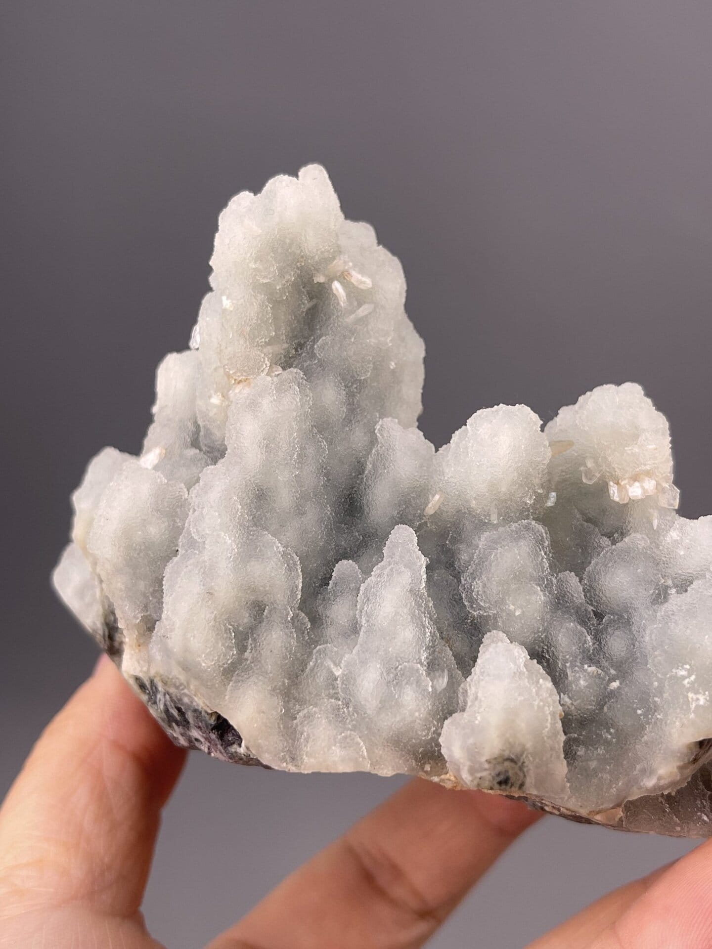 Close-up of quartz botryoids showing matte luster and blue tones