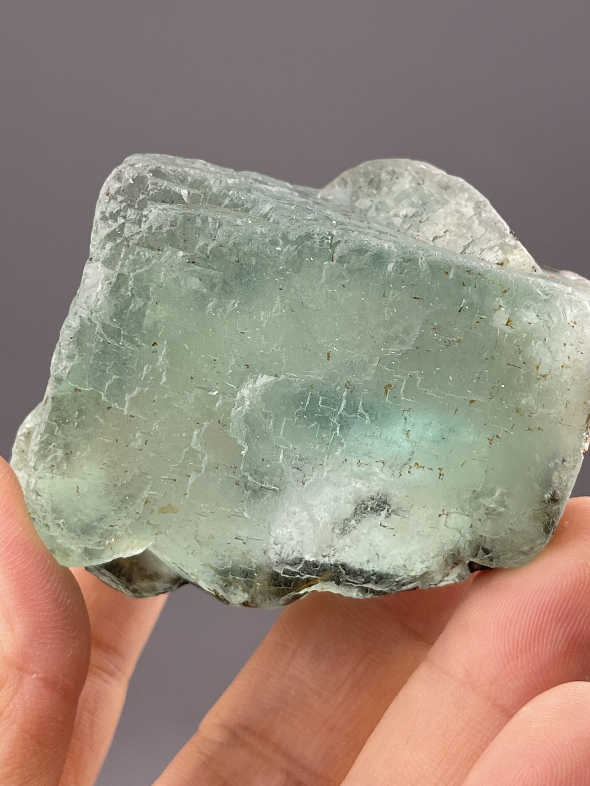 Translucent Green Fluorite Cube from Yaogangxian Mine, Hunan – angled view showing matrix