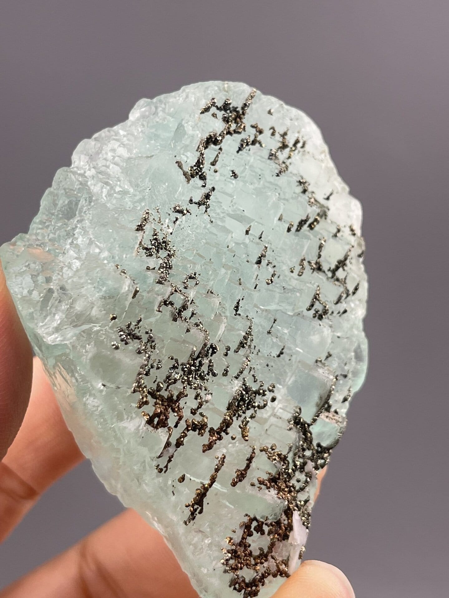Translucent Light Green Fluorite Cube from Yaogangxian Mine – angled view showing matrix