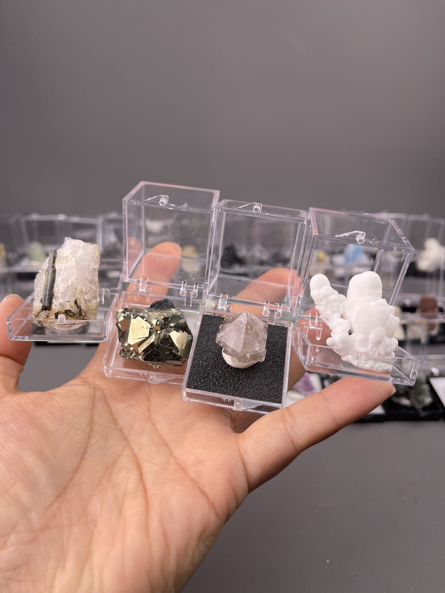 Grouped view of miniature minerals showing mixed species and colours