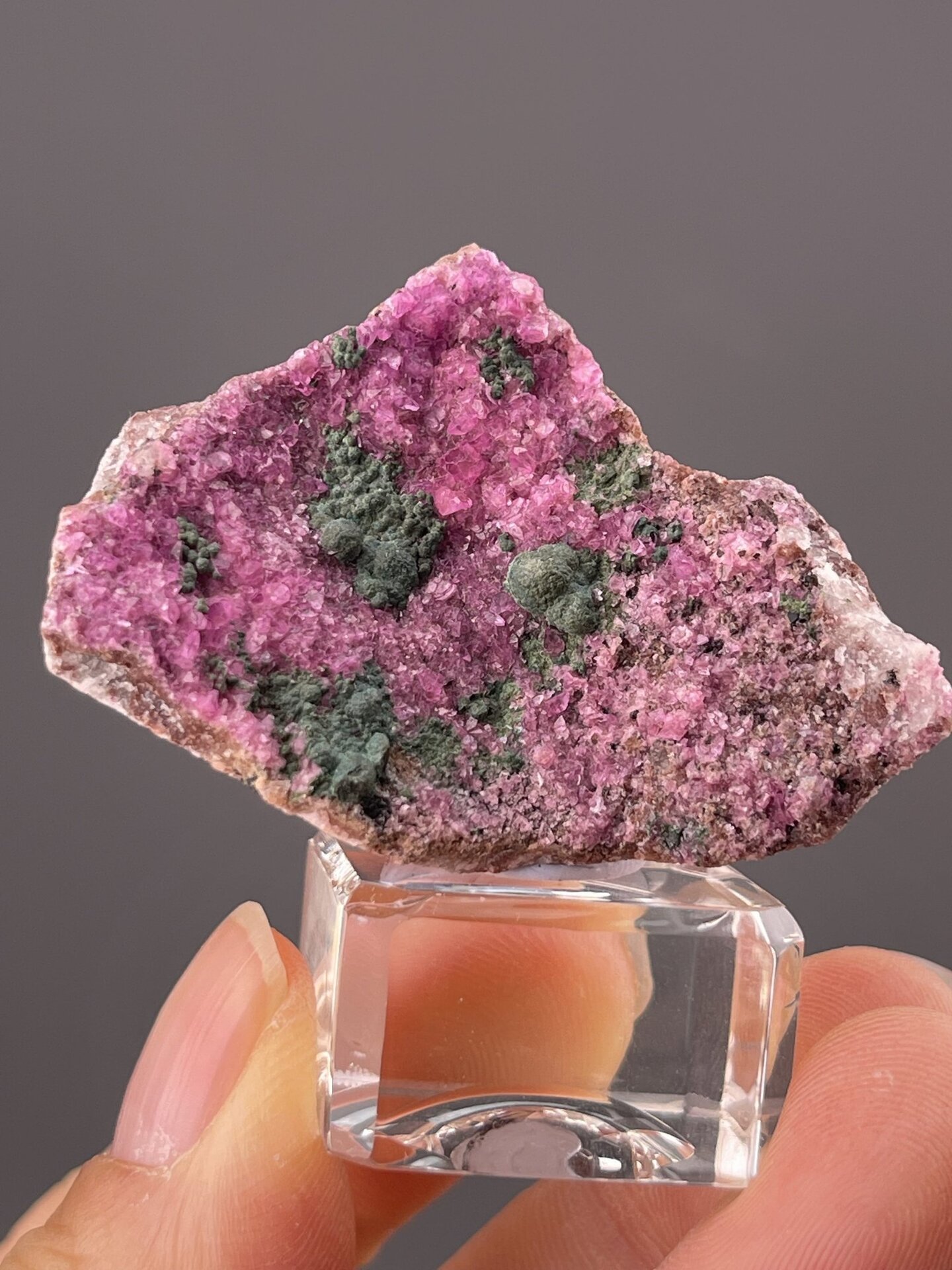 Close-up of pink manganocalcite showing colour contrast with hemimorphite