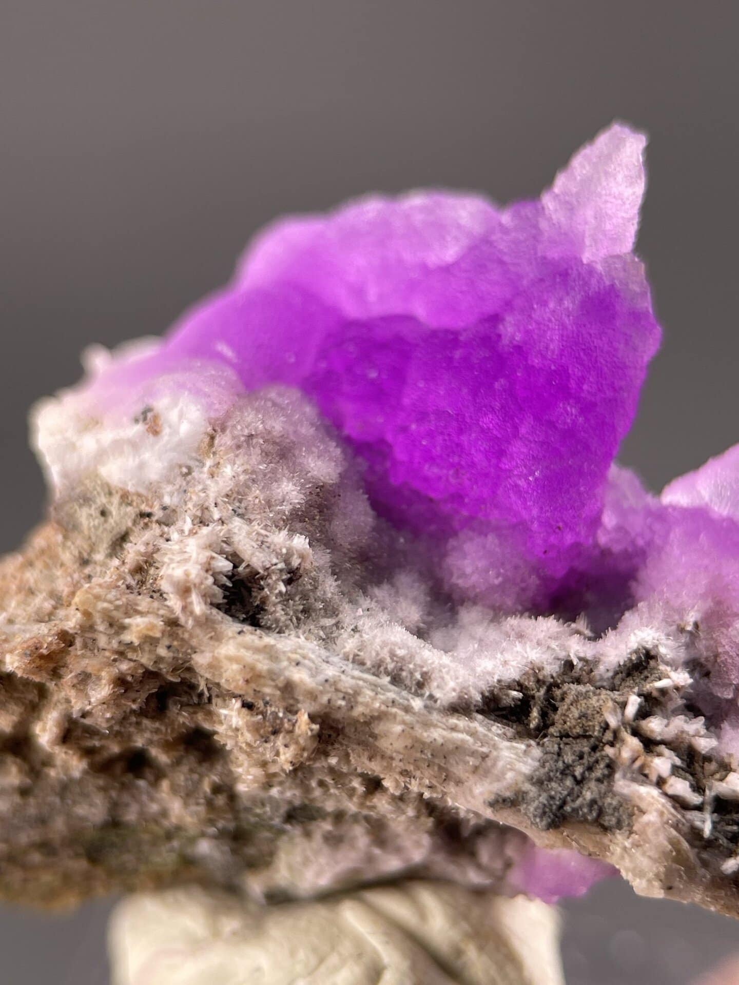 Angled view of Yunnan rhodochrosite highlighting pink colour