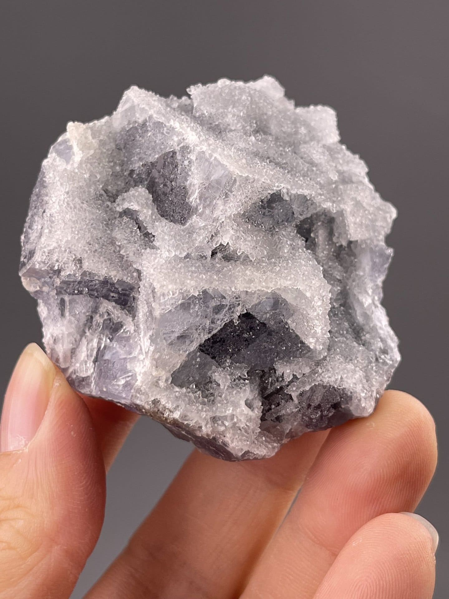Side view of fluorite cluster showing interlocked cubic crystal forms