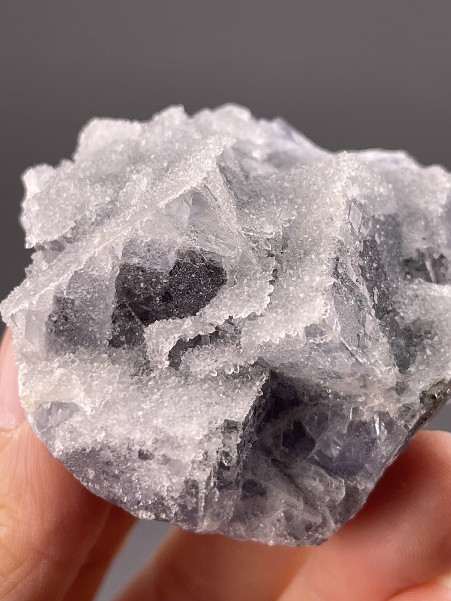 Detail of fluorite crystal faces showing transparency and purple hue