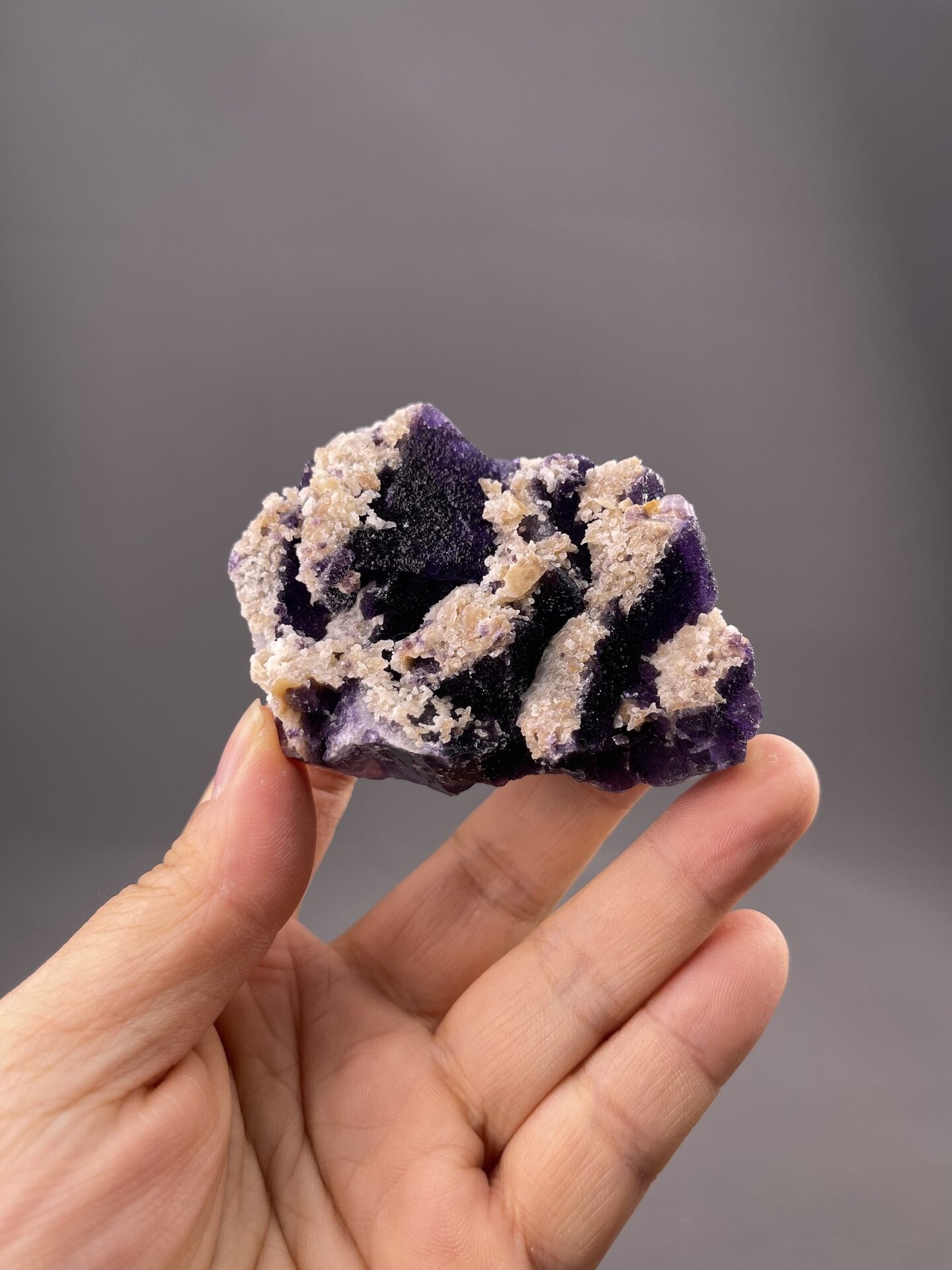 Deep purple fluorite cluster from Guizhou Province, China, isometric cubic