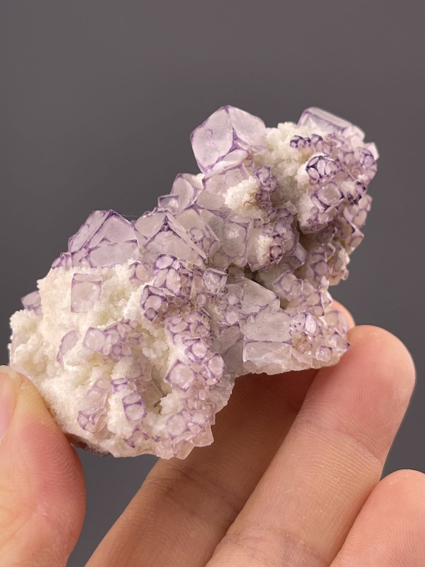 Close-up of fluorite cube faces showing colour zoning pattern