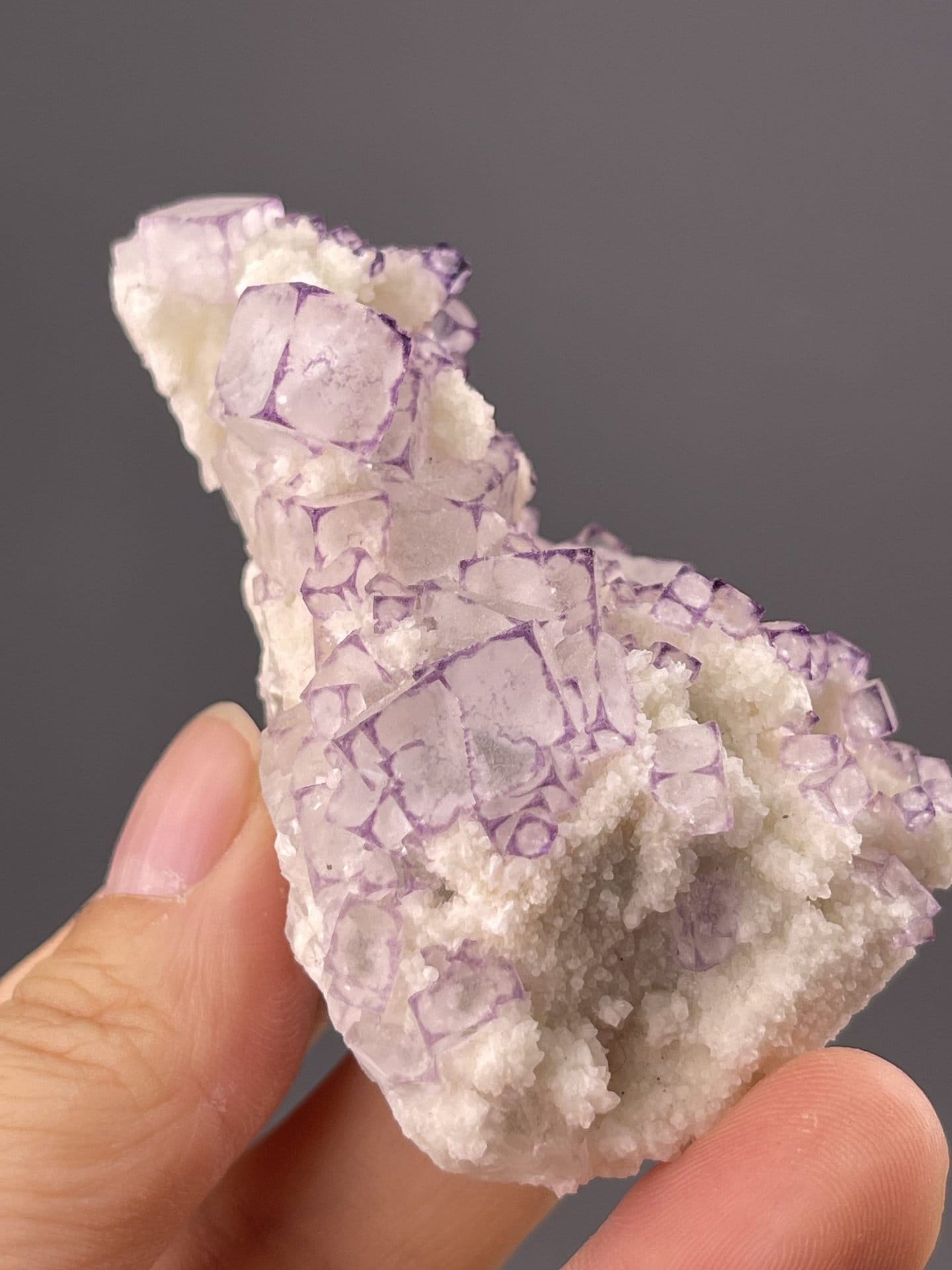 Top view of fluorite cube showing zoned cubic face