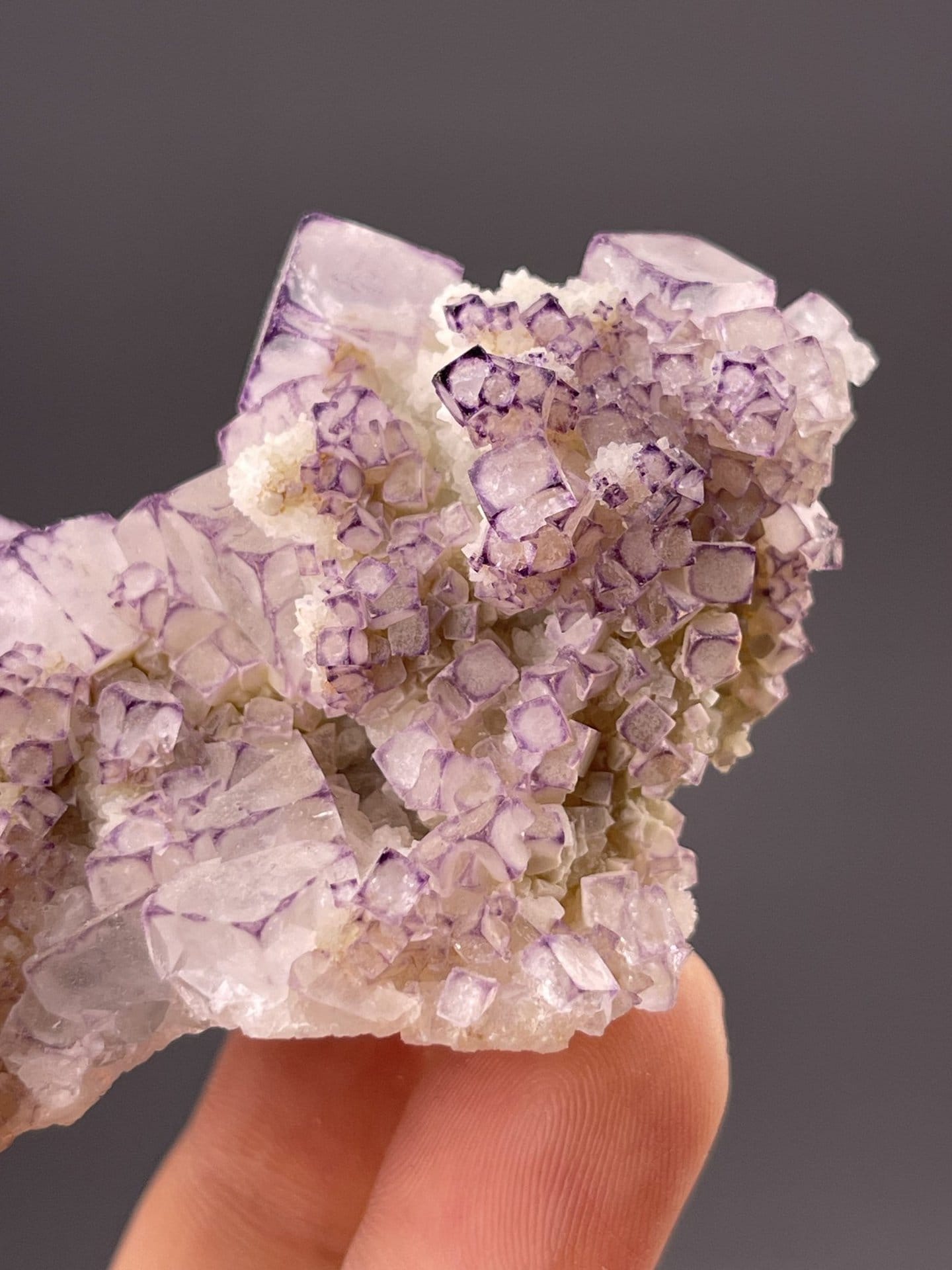 Detail of fluorite crystal showing vitreous luster and purple hue