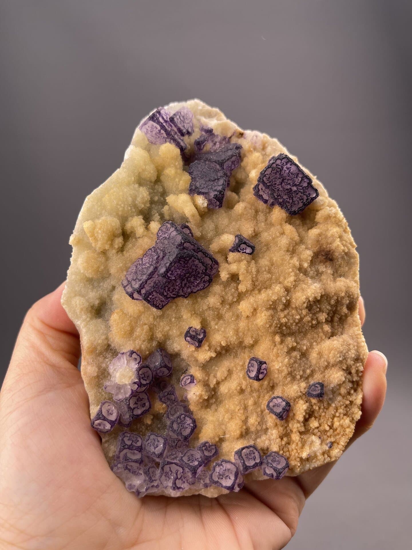 Angled view of Guizhou fluorite cube highlighting deep colour