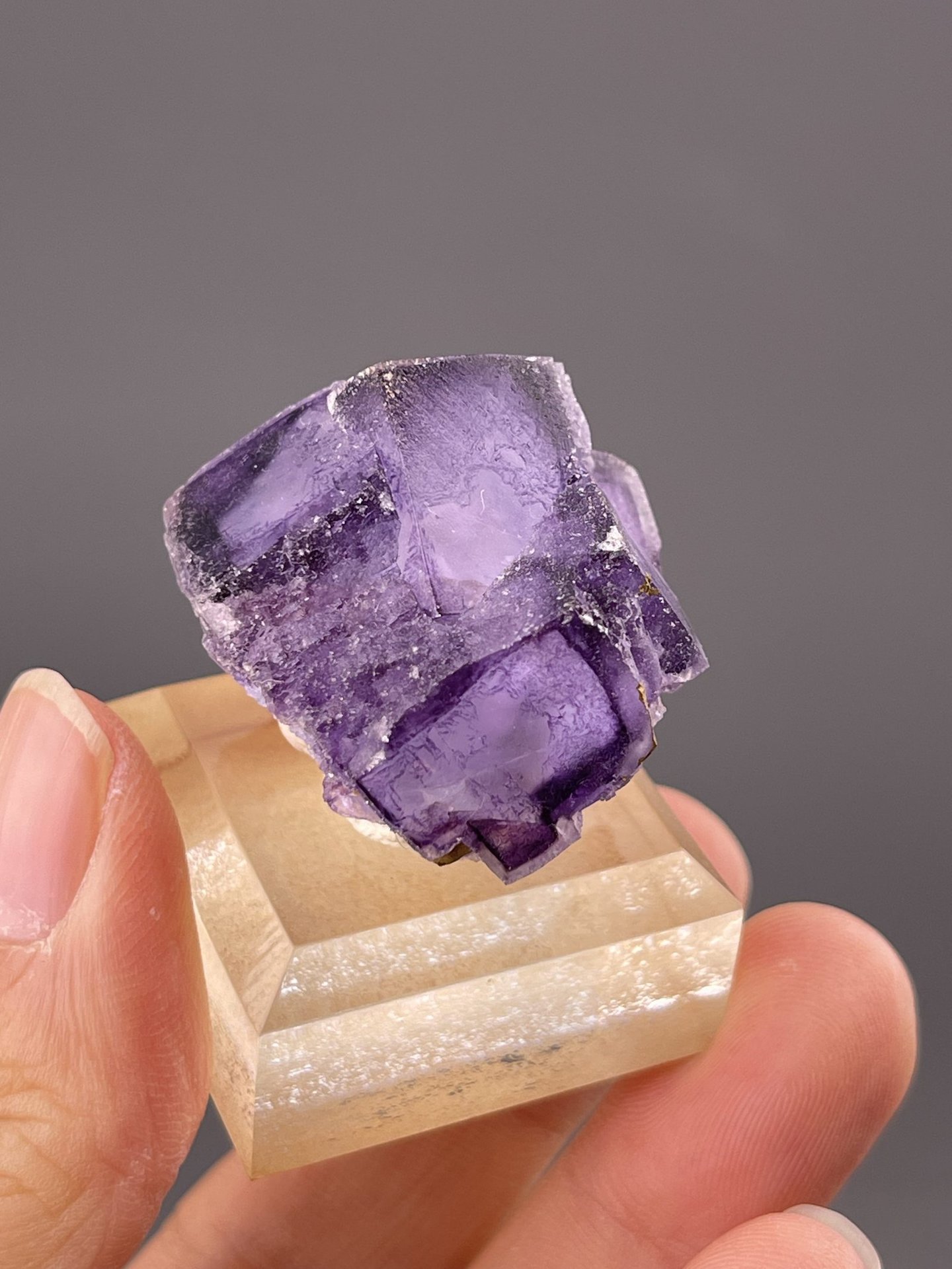 Side view of fluorite cube showing sharp cubic crystal geometry
