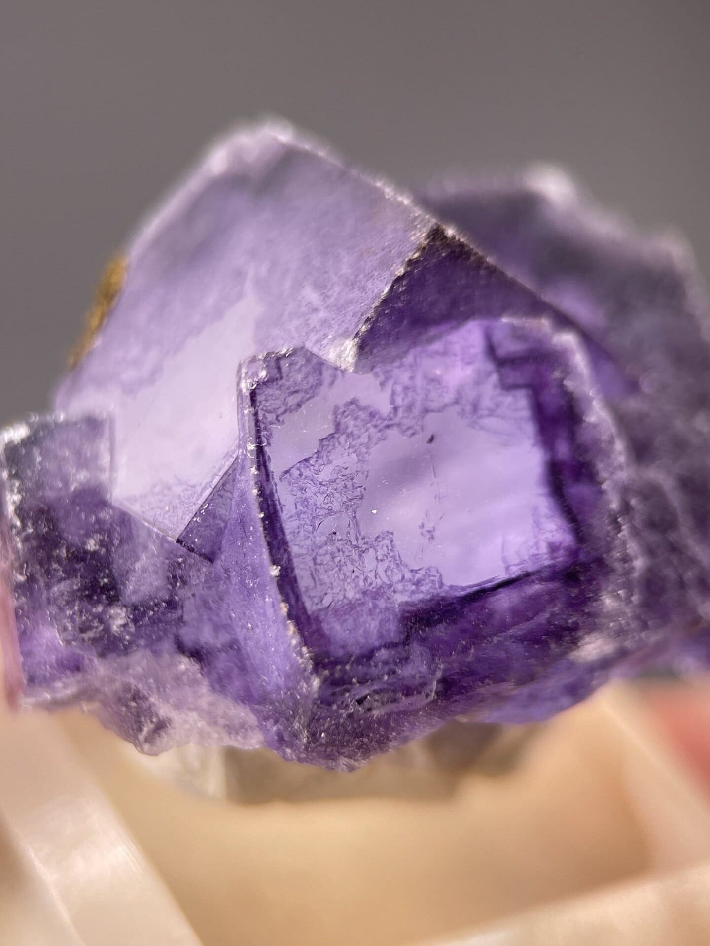 Detail of fluorite crystal showing vitreous luster and purple tone