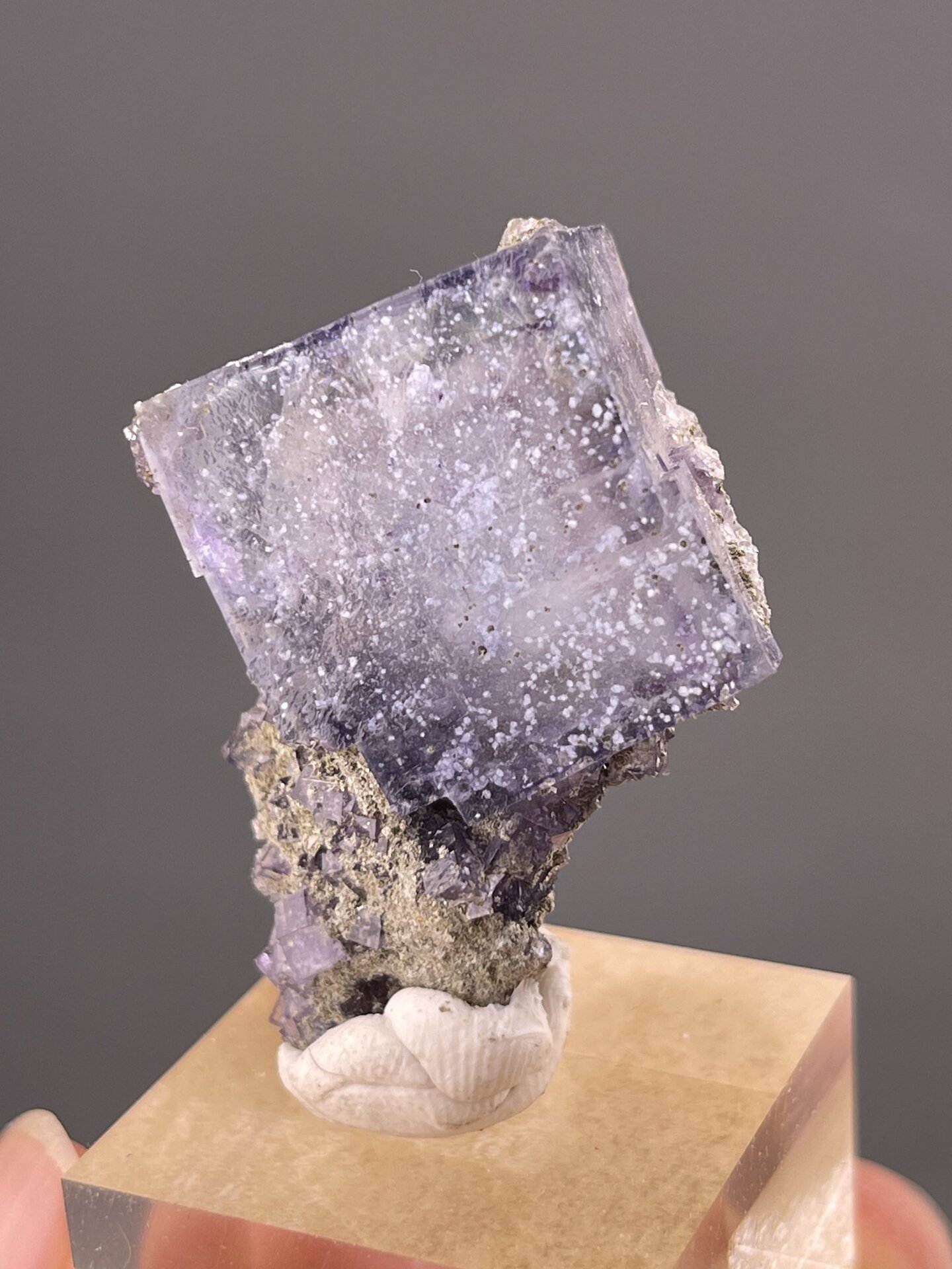 Close-up of cubic fluorite faces showing purple colour and transparency