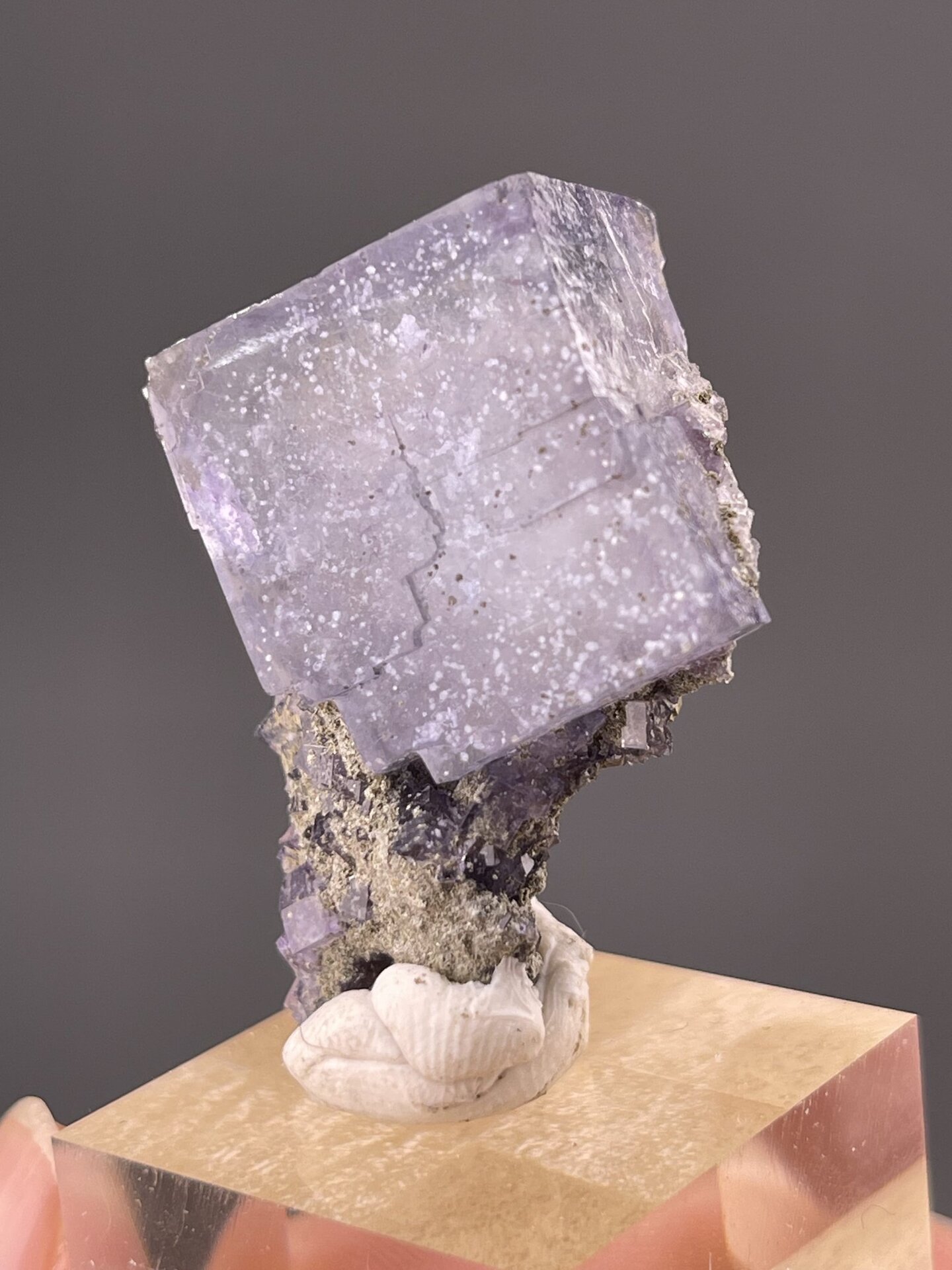 Side view of fluorite cube showing sharp crystallographic faces