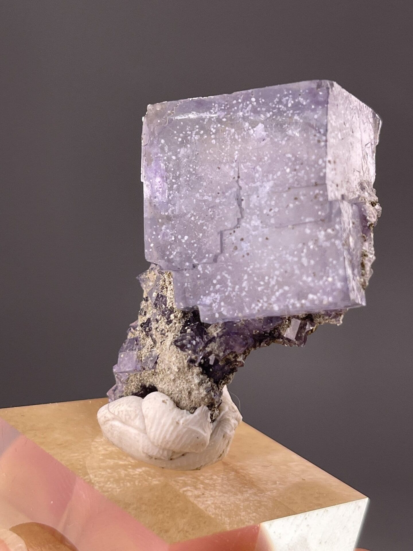Detail of fluorite crystal showing vitreous luster on purple surfaces