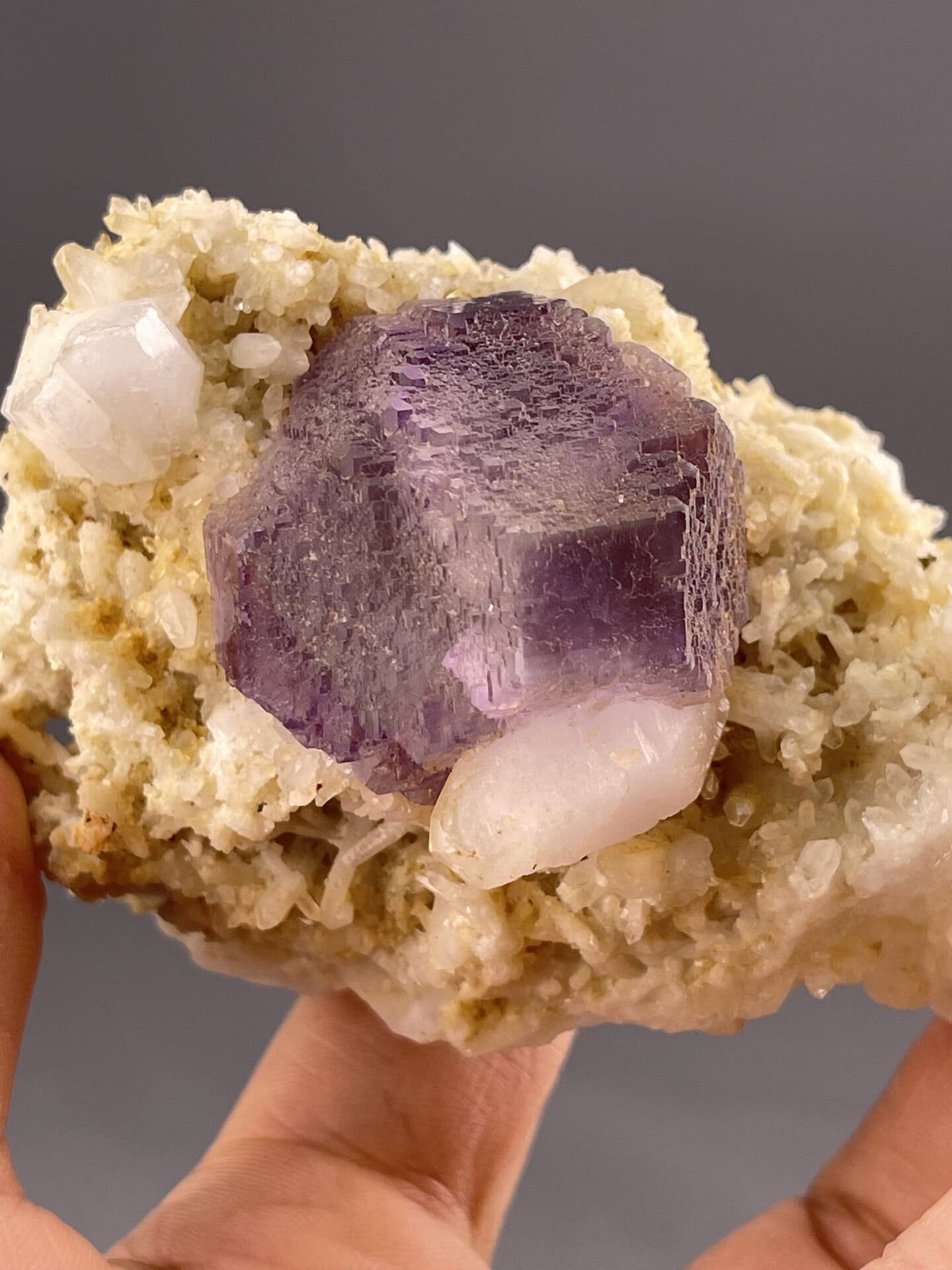 Deep Purple Fluorite Crystal from Shangbao Mine, Hunan – angled view showing matrix