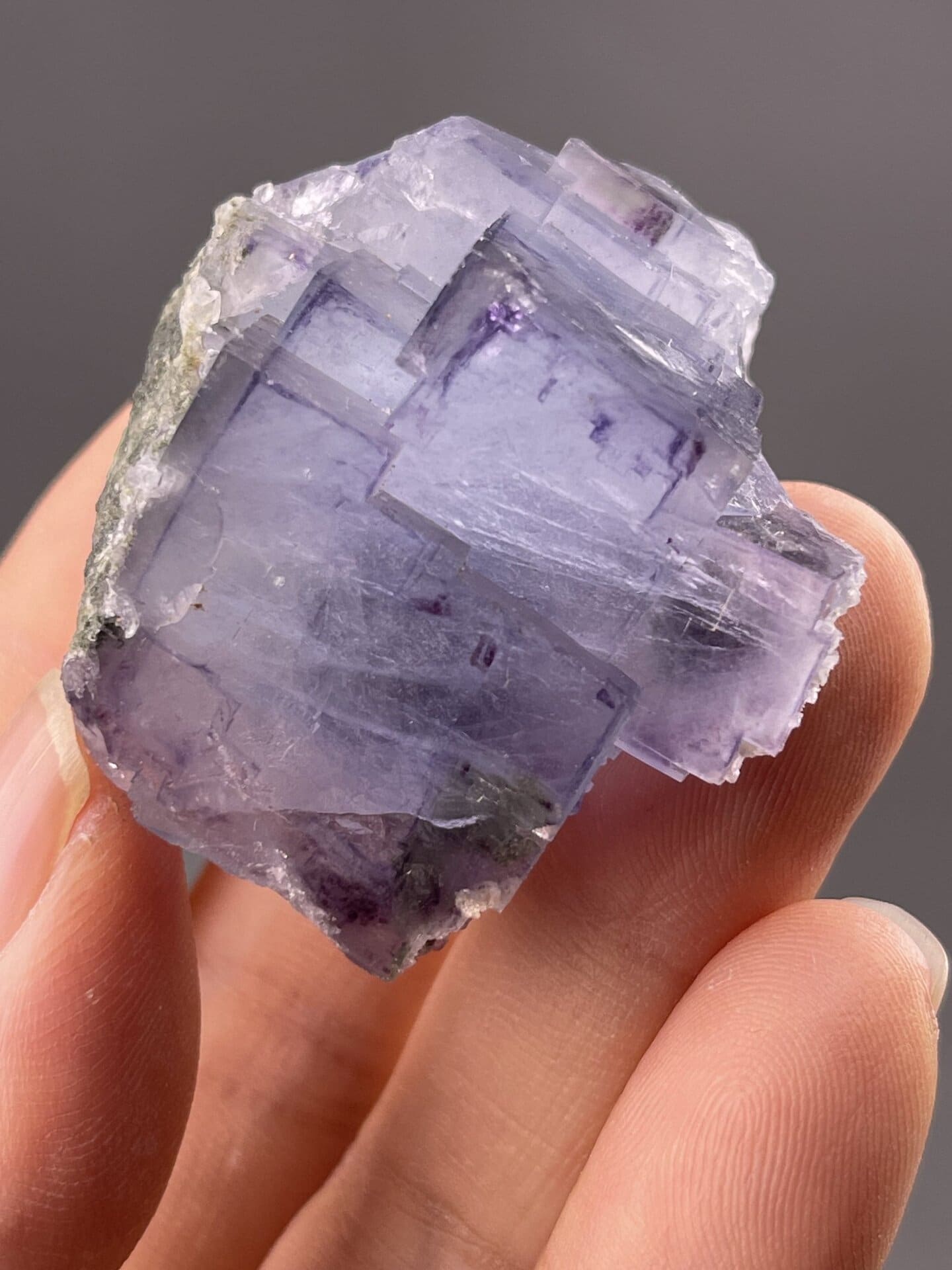 Angled view of purple phantom fluorite displaying colour depth