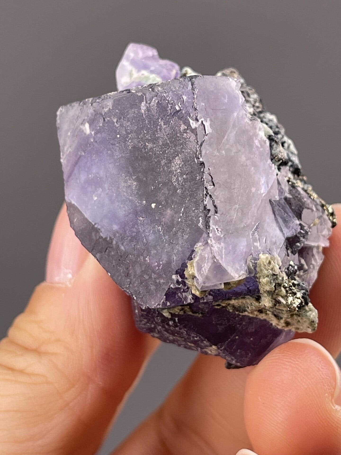 Zoned fluorite cube showing purple phantom growth layers, 1.8 g