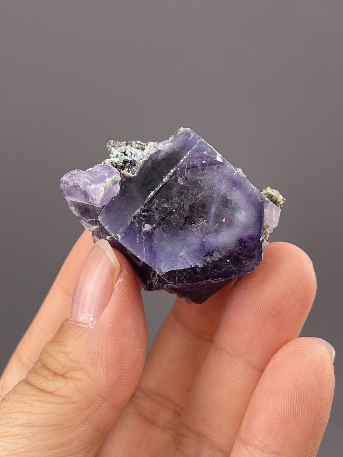 Close-up of fluorite cube showing purple colour zoning