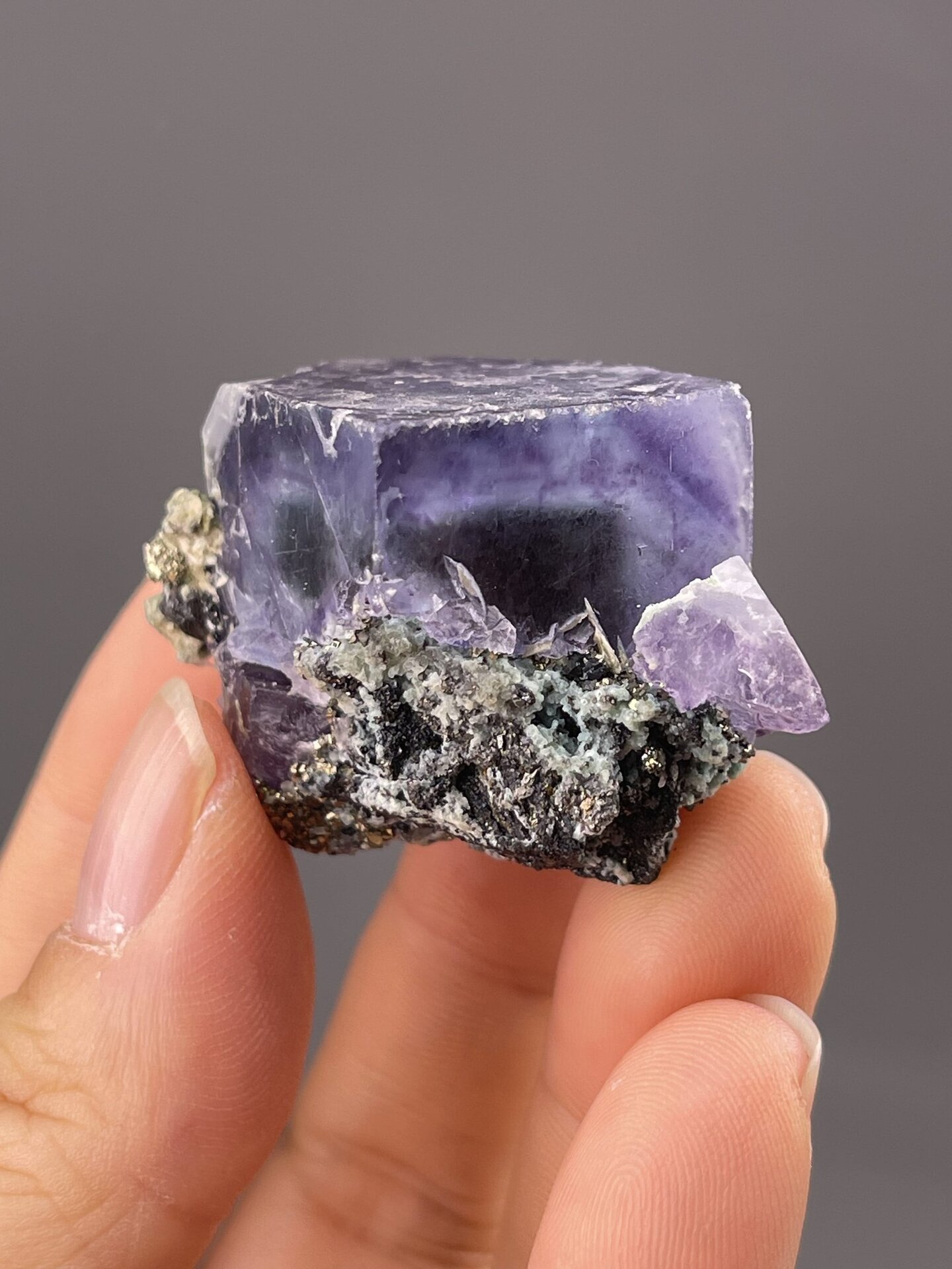 Detail of fluorite faces showing vitreous luster and purple hue