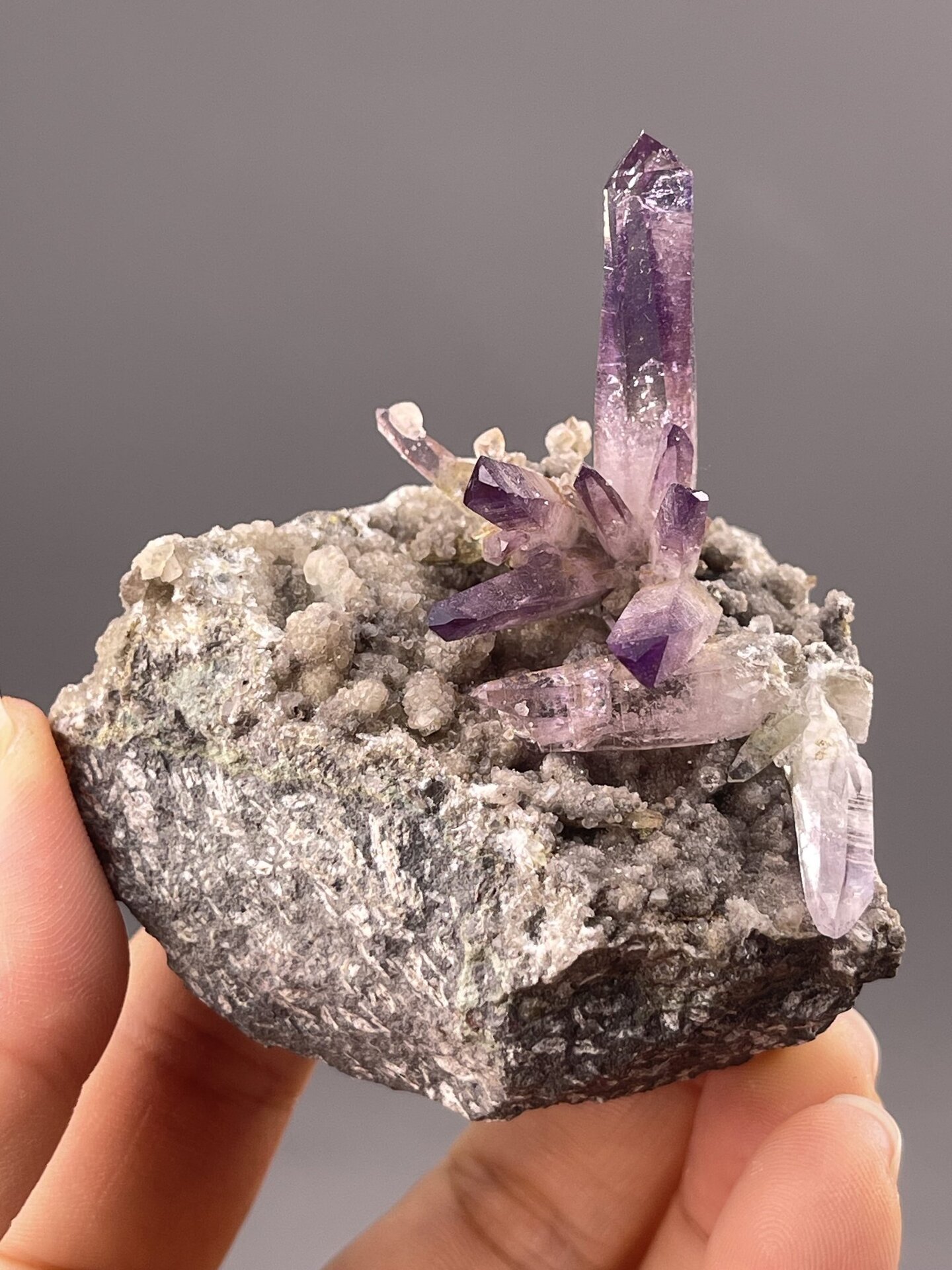 Amethyst Crystal Clusters from Vera Cruz, Mexico – angled view showing matrix