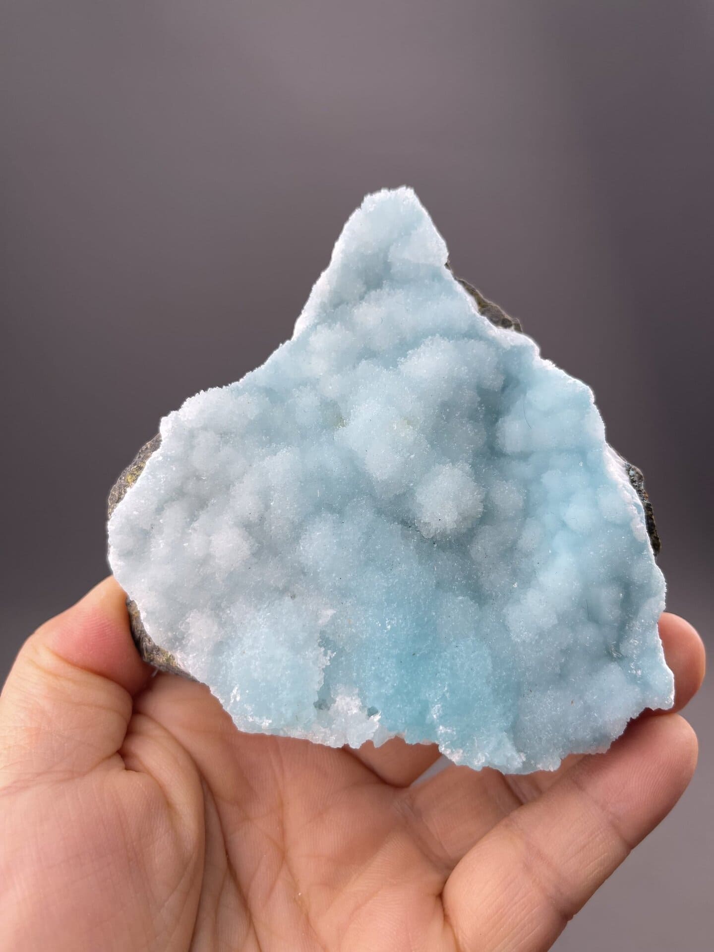 Translucent sky-blue hemimorphite showing rounded botryoidal surface, 7.8 g