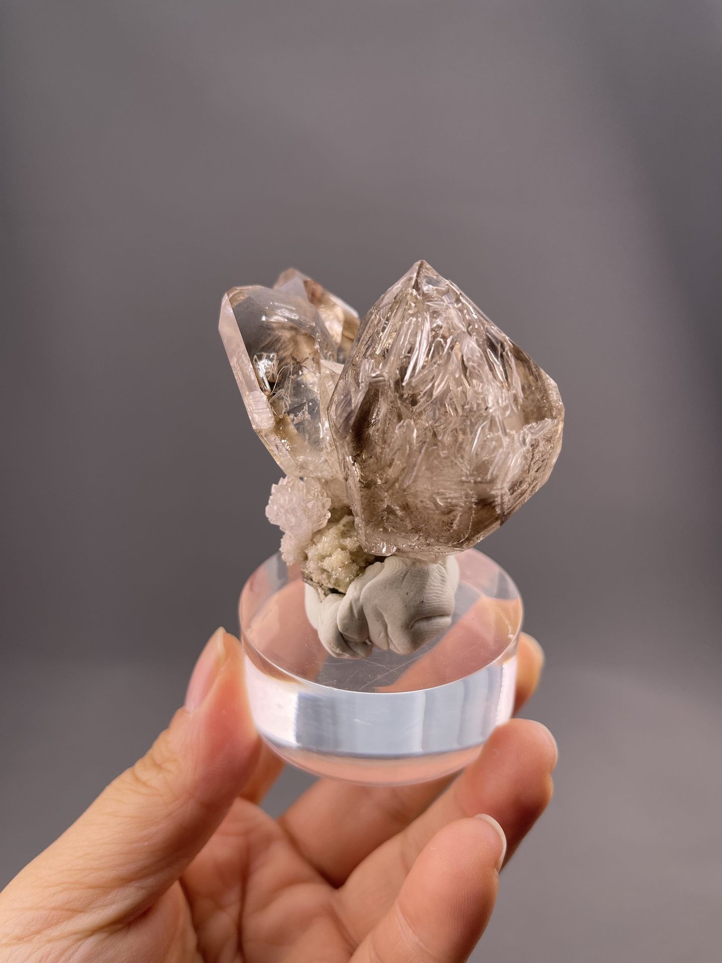 Close-up of quartz crystal faces showing smoky brown-gray tone