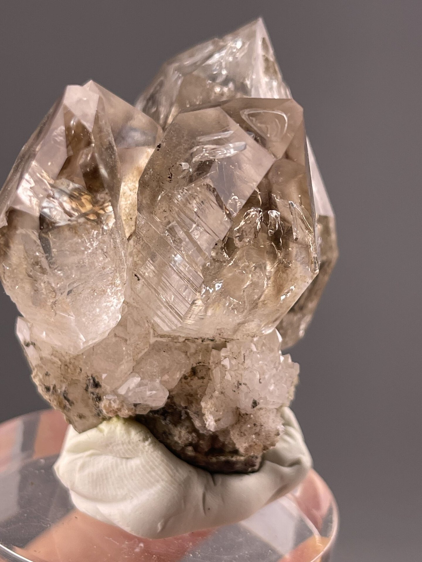 Angled view highlighting vitreous sheen on smoky quartz surfaces