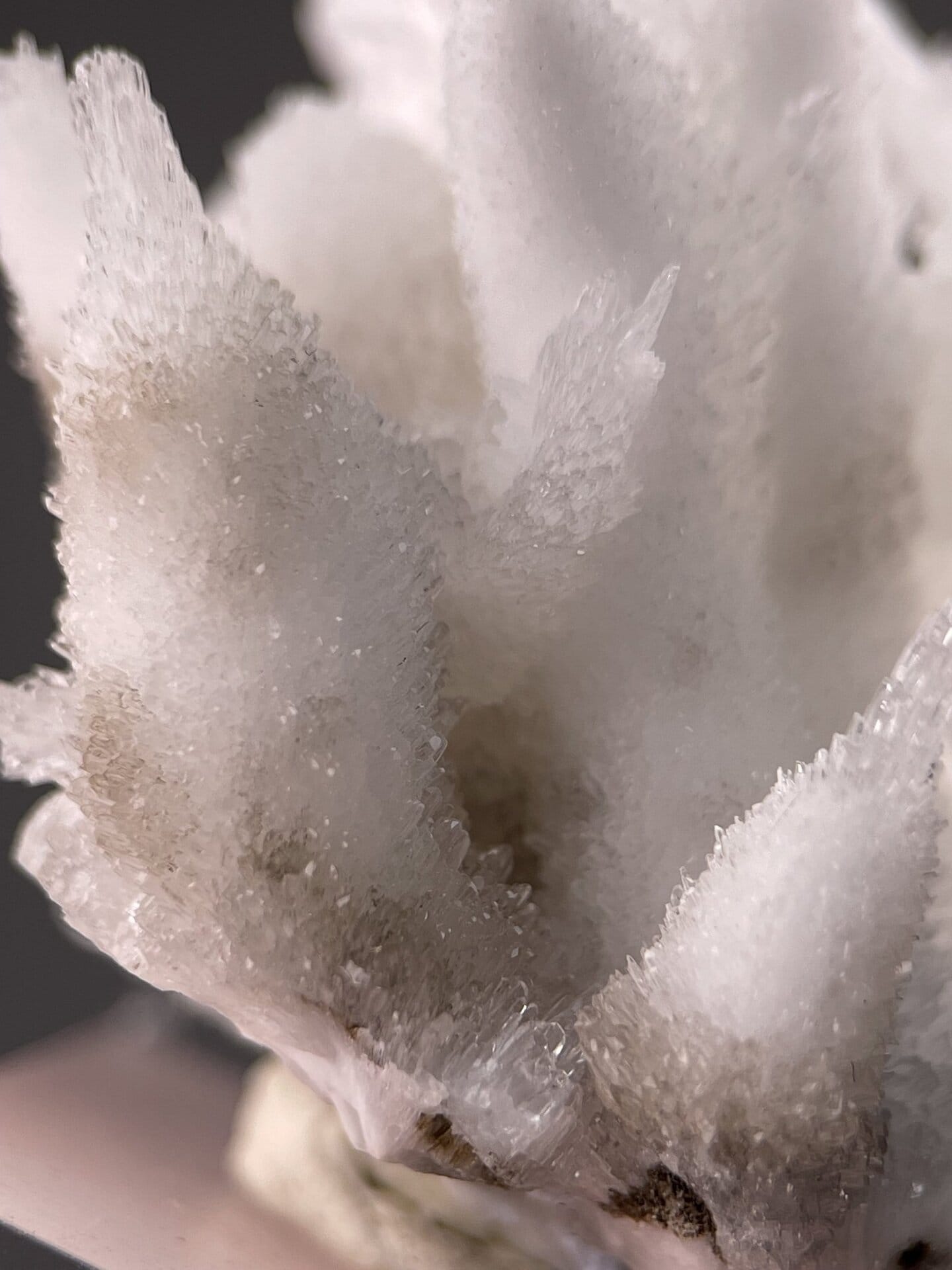 Needle-like aragonite crystals showing dark inclusion matrix, 1.6 g