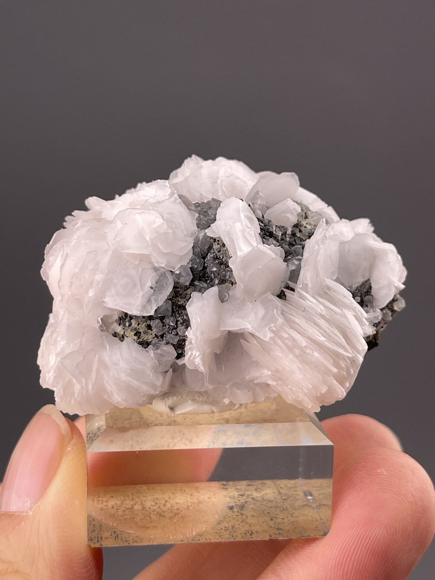 Pearlescent white calcite showing layered crystal structure, 1.8 g