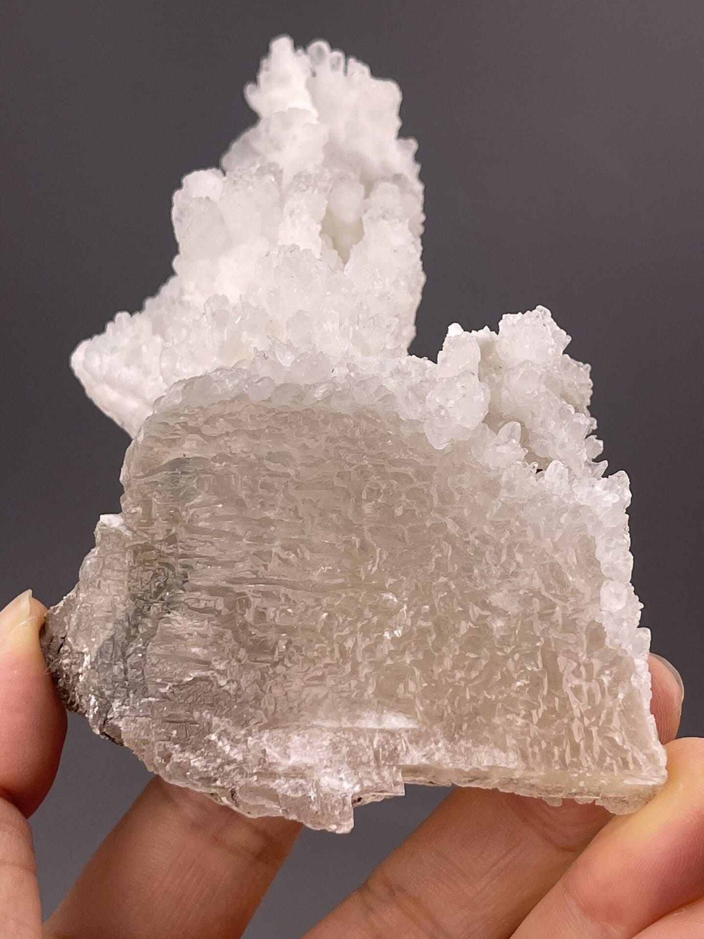 Side view of calcite specimen showing sculptural stacking of crystals