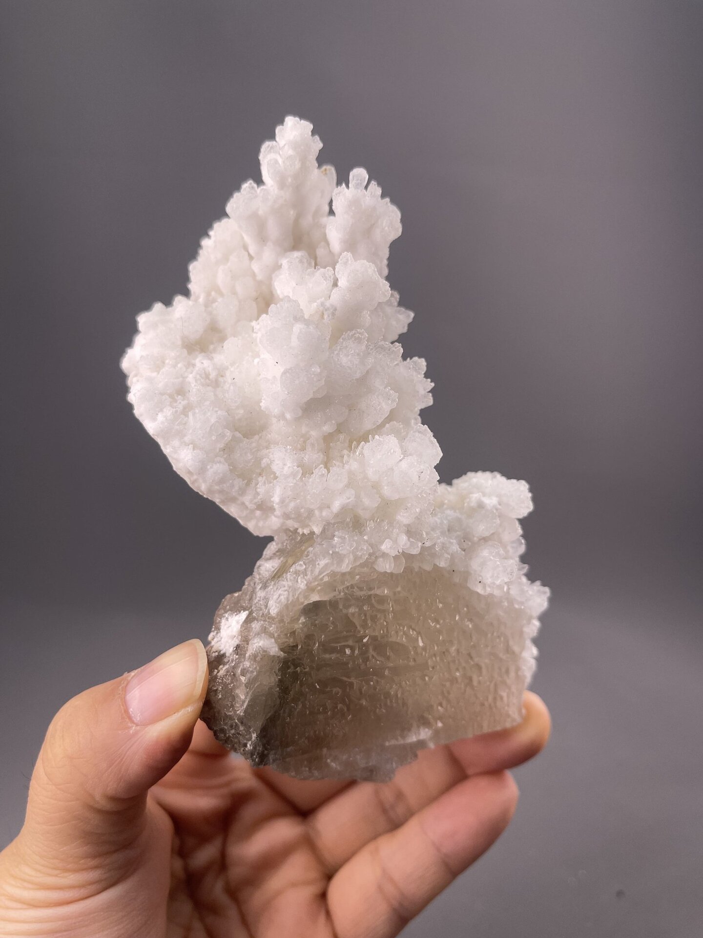 Angled view of Lanwen Mine calcite cluster showing translucent crystal edges
