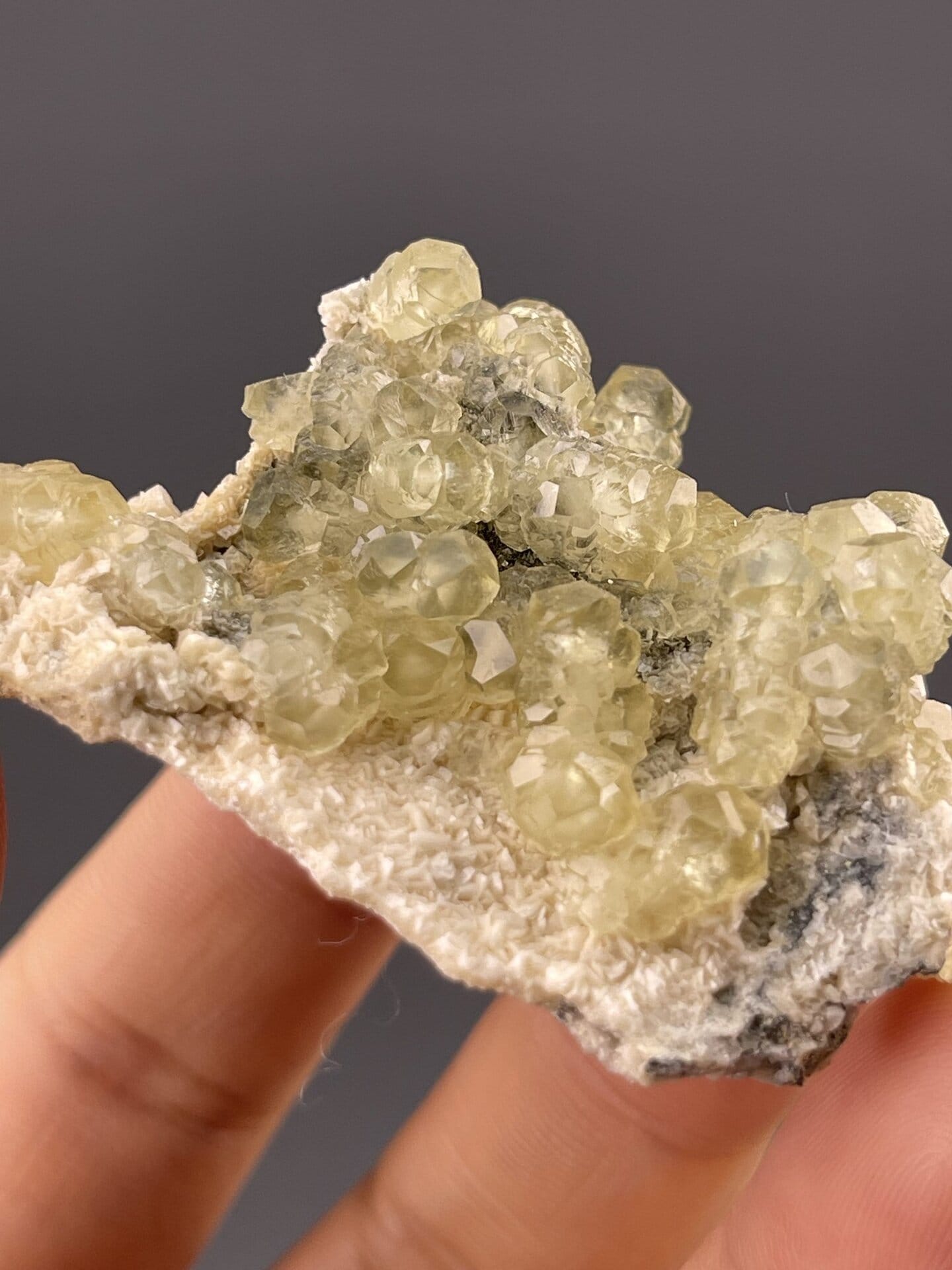 Pale yellow calcite showing rounded botryoidal surface, 0.9 g