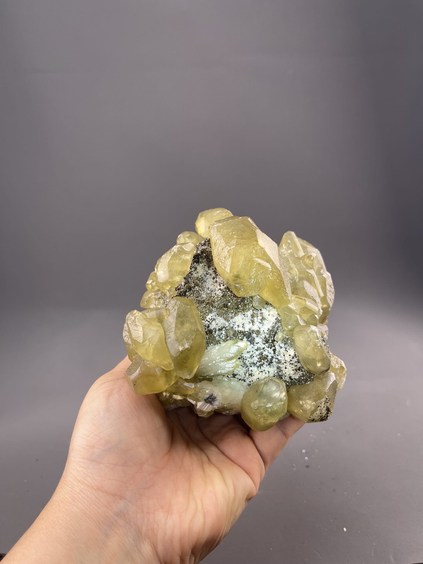 Yellow Calcite Crystals from Daye Mine, Hubei, China – angled view showing matrix