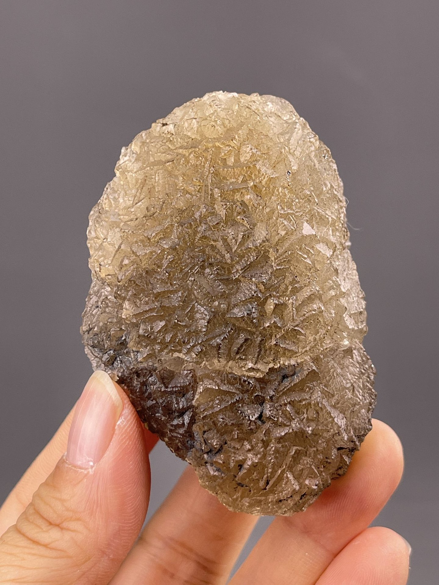 Close-up of yellow fluorite showing rounded botryoidal surface
