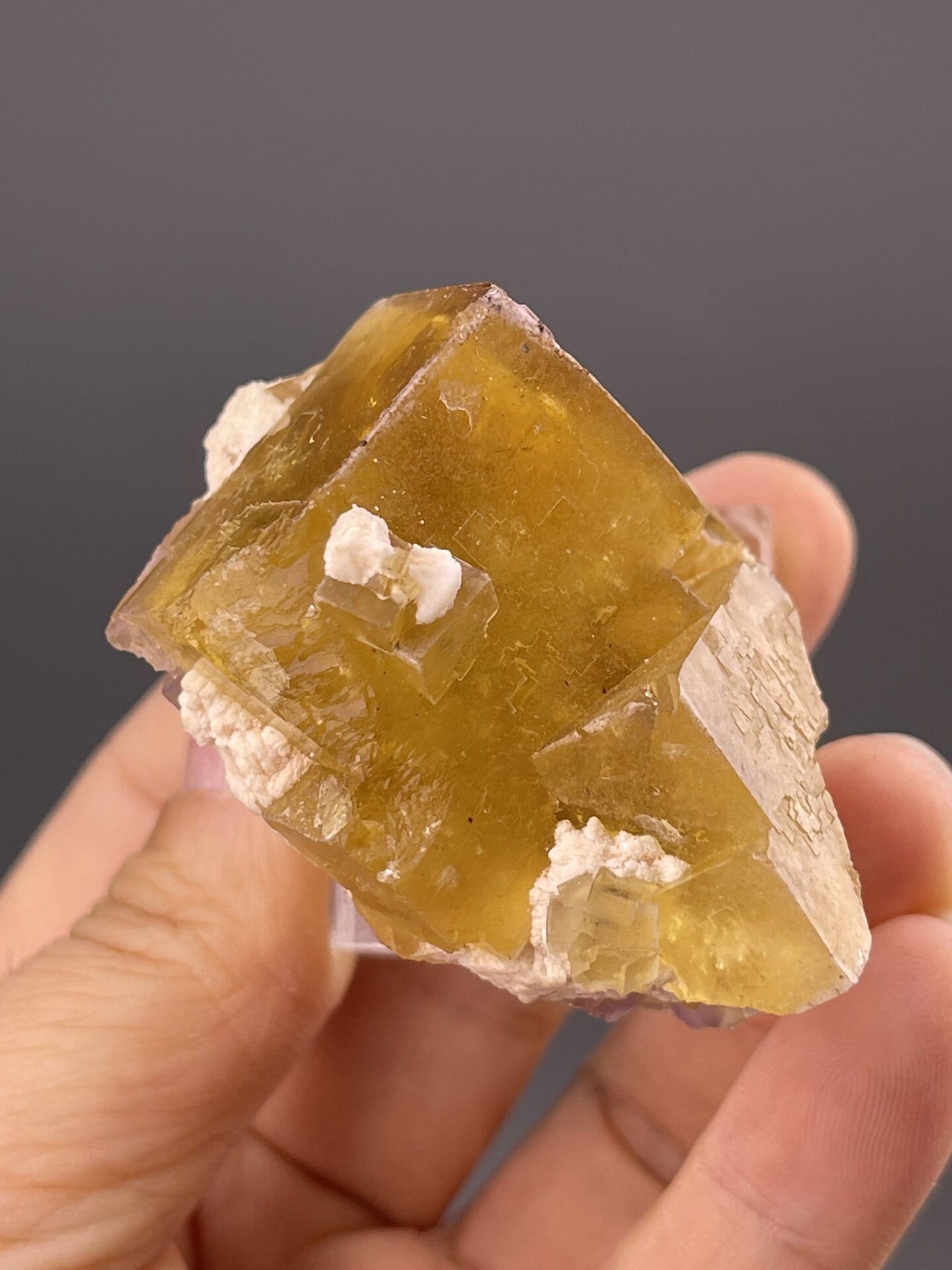 Angled view of Yanqing fluorite cube highlighting yellow colour