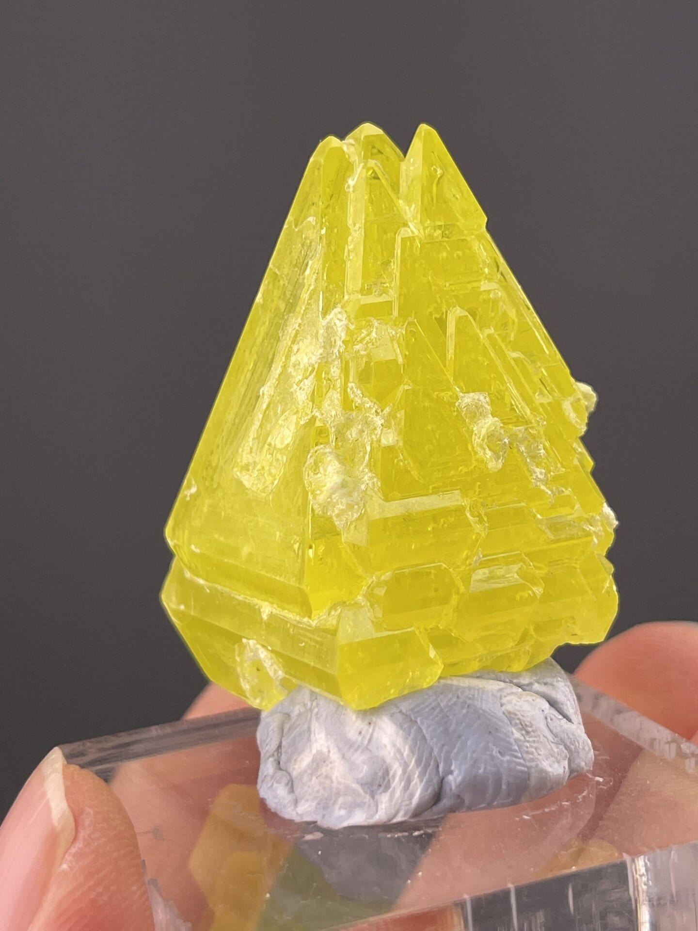 Detail of sulfur crystal surfaces showing translucent yellow body