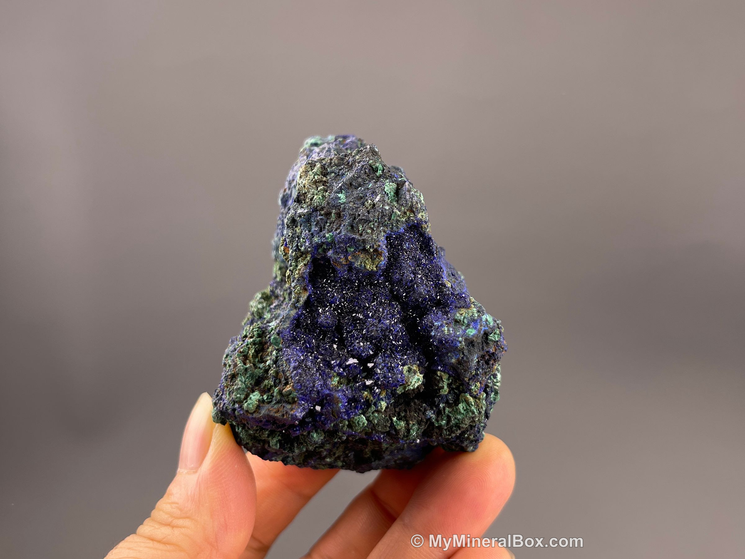 Deep-blue azurite intergrown with green malachite, a copper-carbonate pairing collectors handle safely by keeping it dry and dust-free