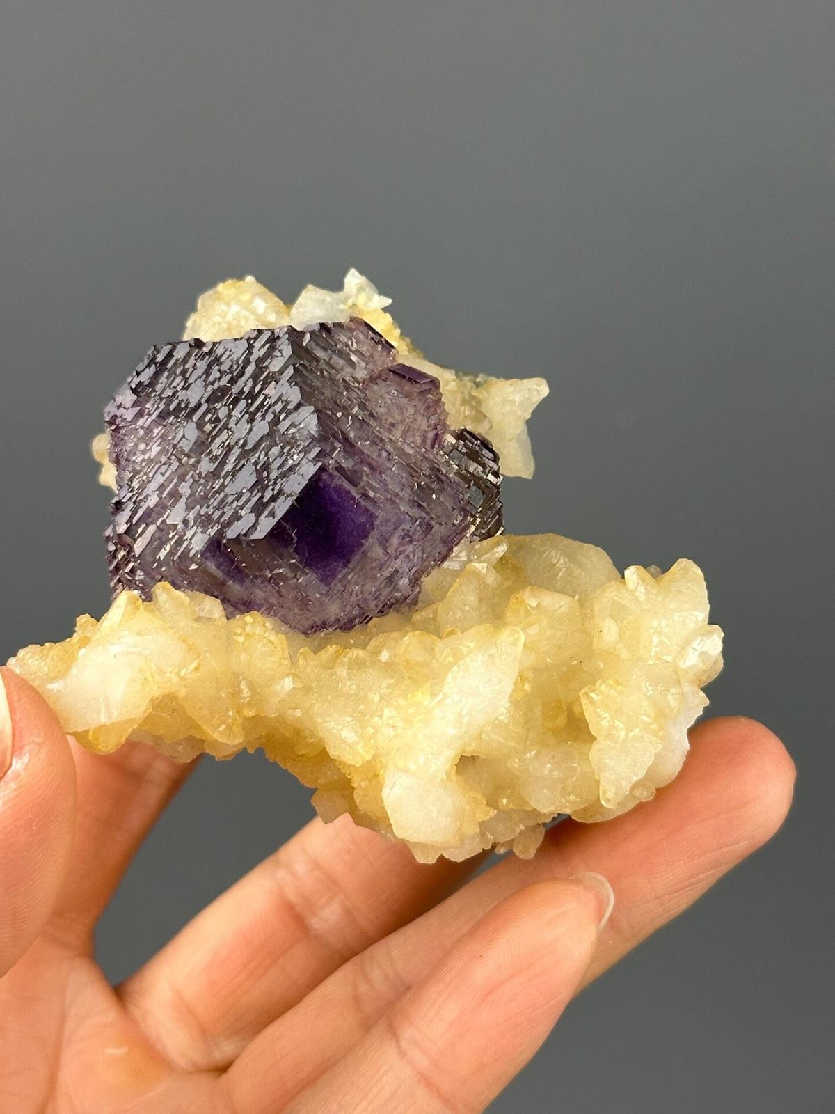 Front view of large etched purple fluorite cluster from Hunan