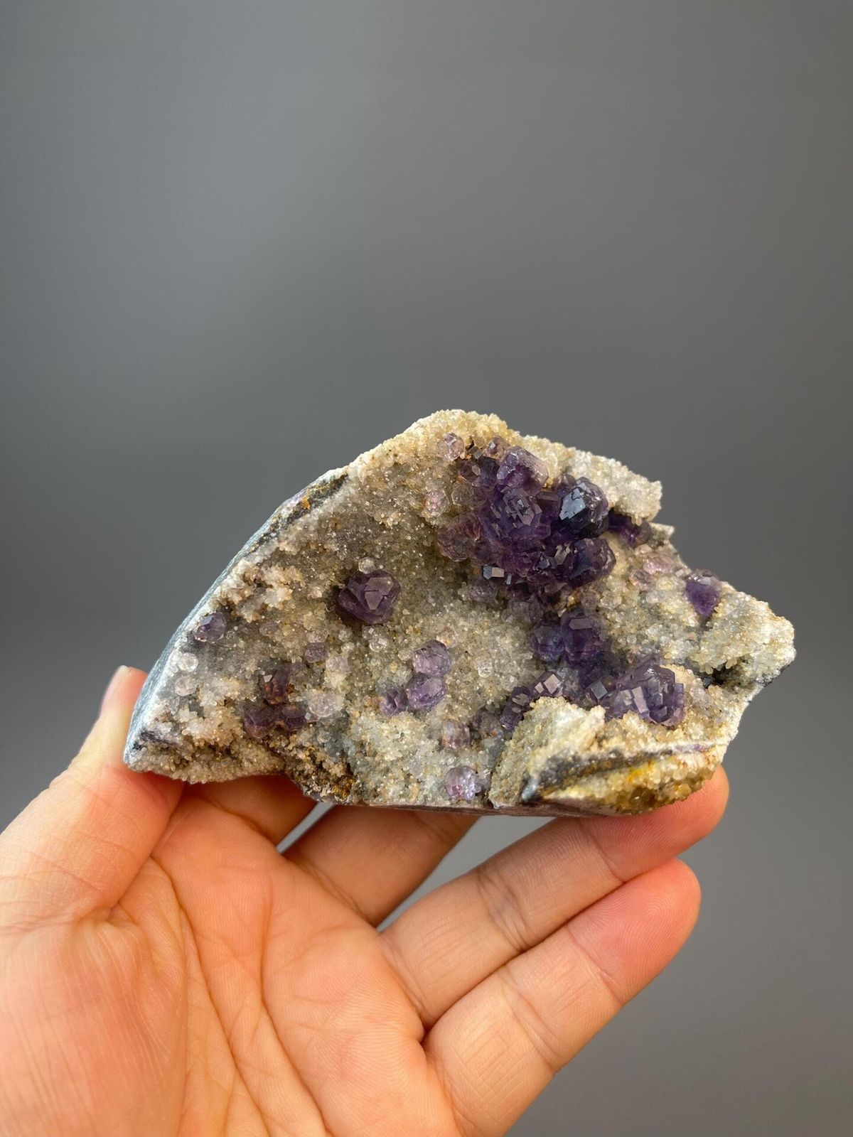 Tanzan fluorite polished spheres on white quartz matrix, Fujian