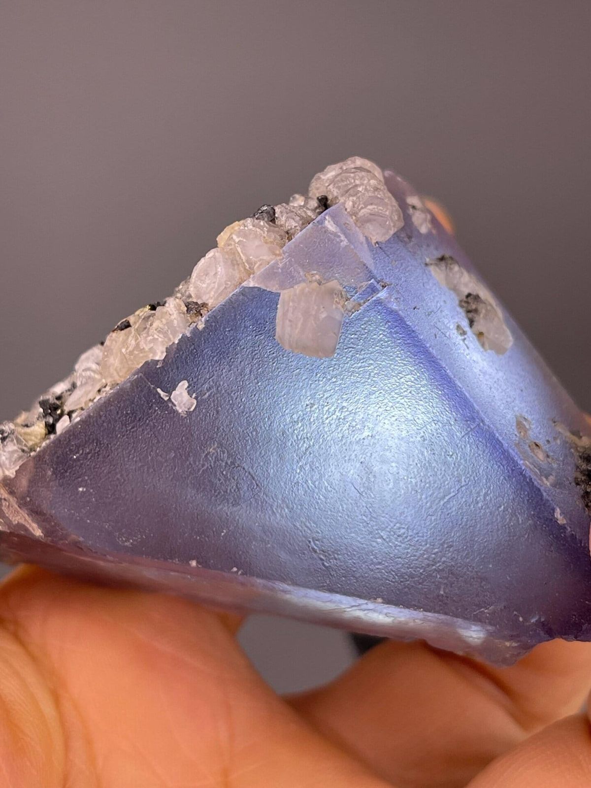 Purple fluorite triangular crystal with calcite, China