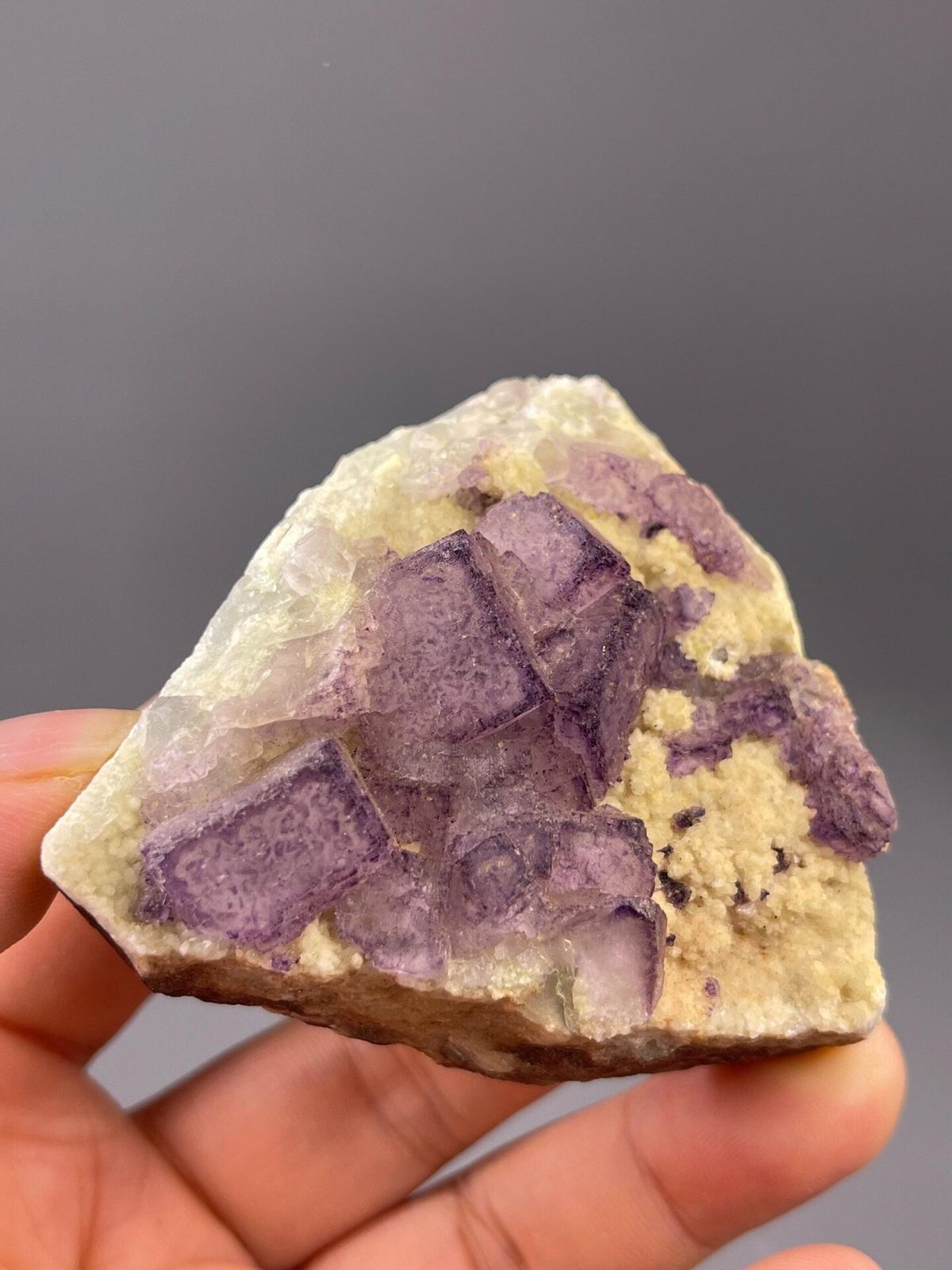 Purple fluorite cluster from Guizhou China front view
