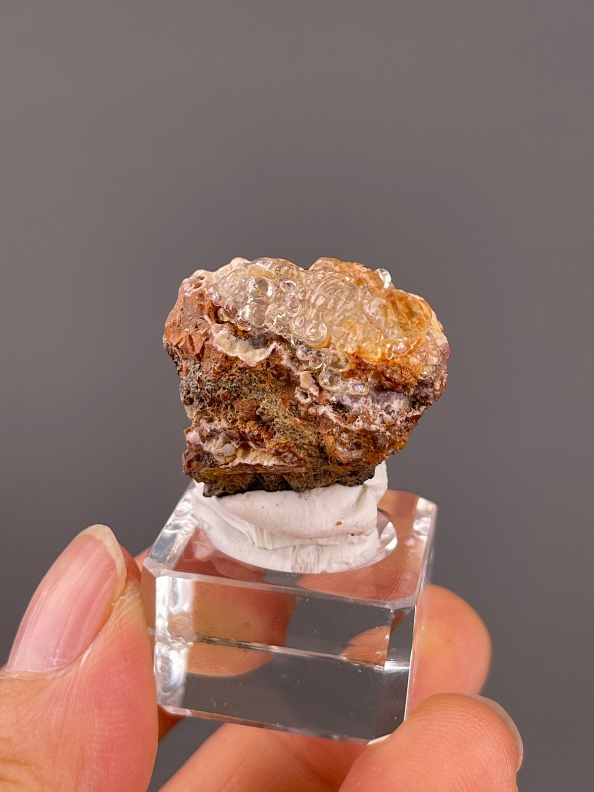 Hyalite Opal from Mexico: clear rounded coating above rusty brown matrix.