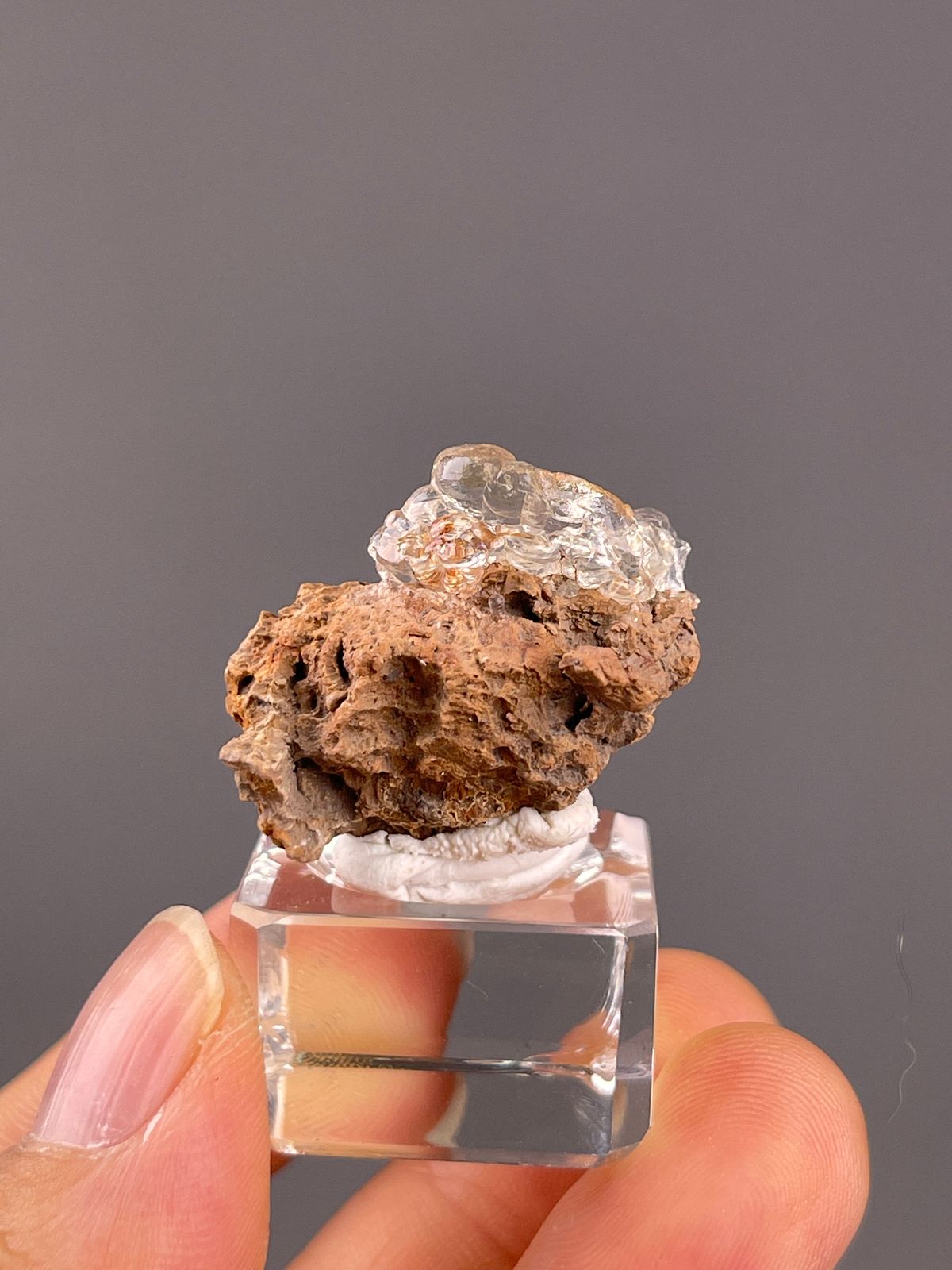 Hyalite Opal from Mexico: clear hyalite coating on porous brown matrix.
