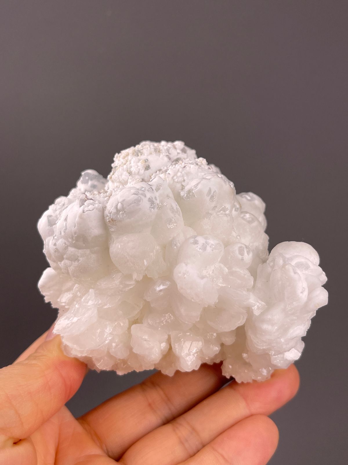 Hydrozincite from Yunnan, China: milky rounded lobes forming a broad cluster.