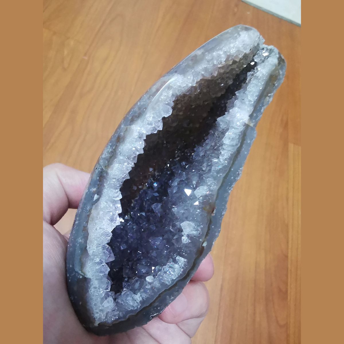 Wide-mouth amethyst geode with polished exterior — complete view