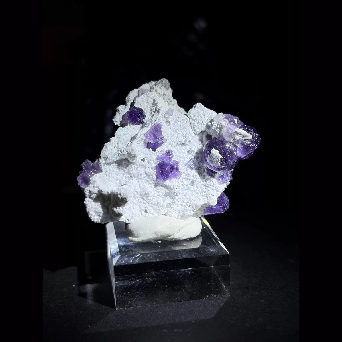 Violet octahedral fluorite on white quartz — complete view