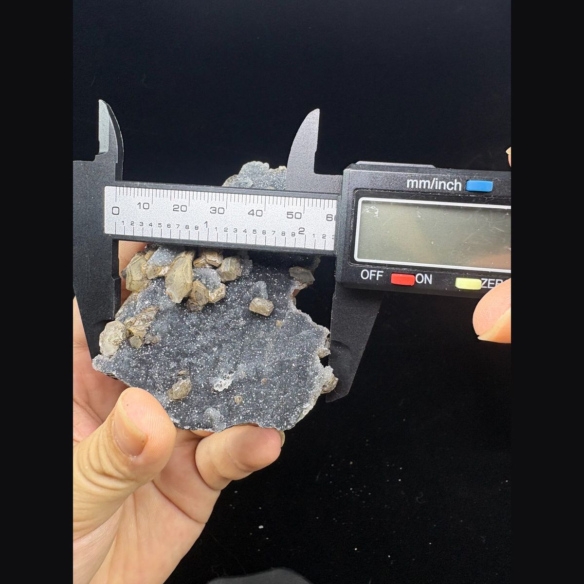 Grey sugary calcite with pseudomorph crystals from Longyan — complete view