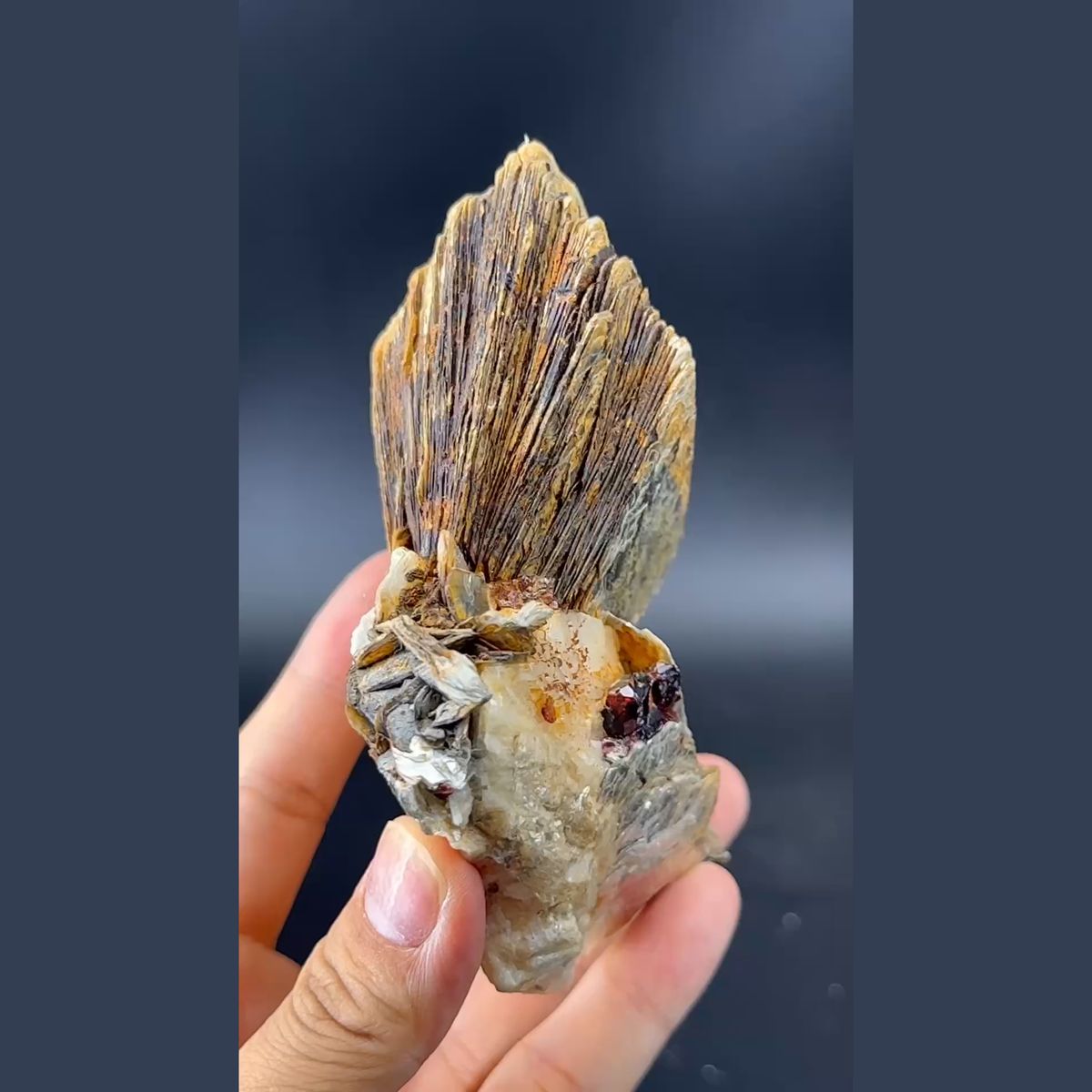 Stacked layered mica books with garnet and feldspar from Pakistan — complete view